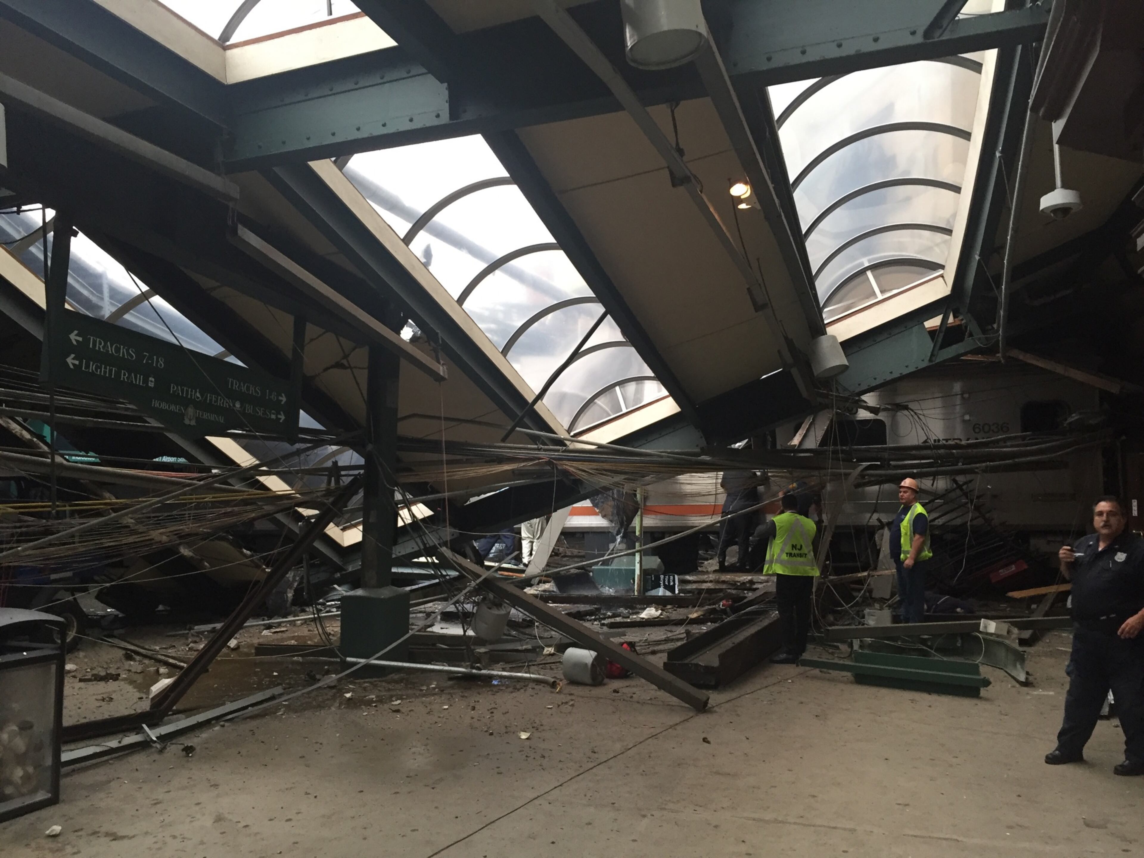 A NJ Transit train seen through the wreckage after it crashed in to the platform at the Hoboken Terminal September 29, 2016 in Hoboken, New Jersey. New Jersey emergency's management system is reporting more than 100 people were injured in the crash. (Photo by Pancho Bernasconi/Getty Images)