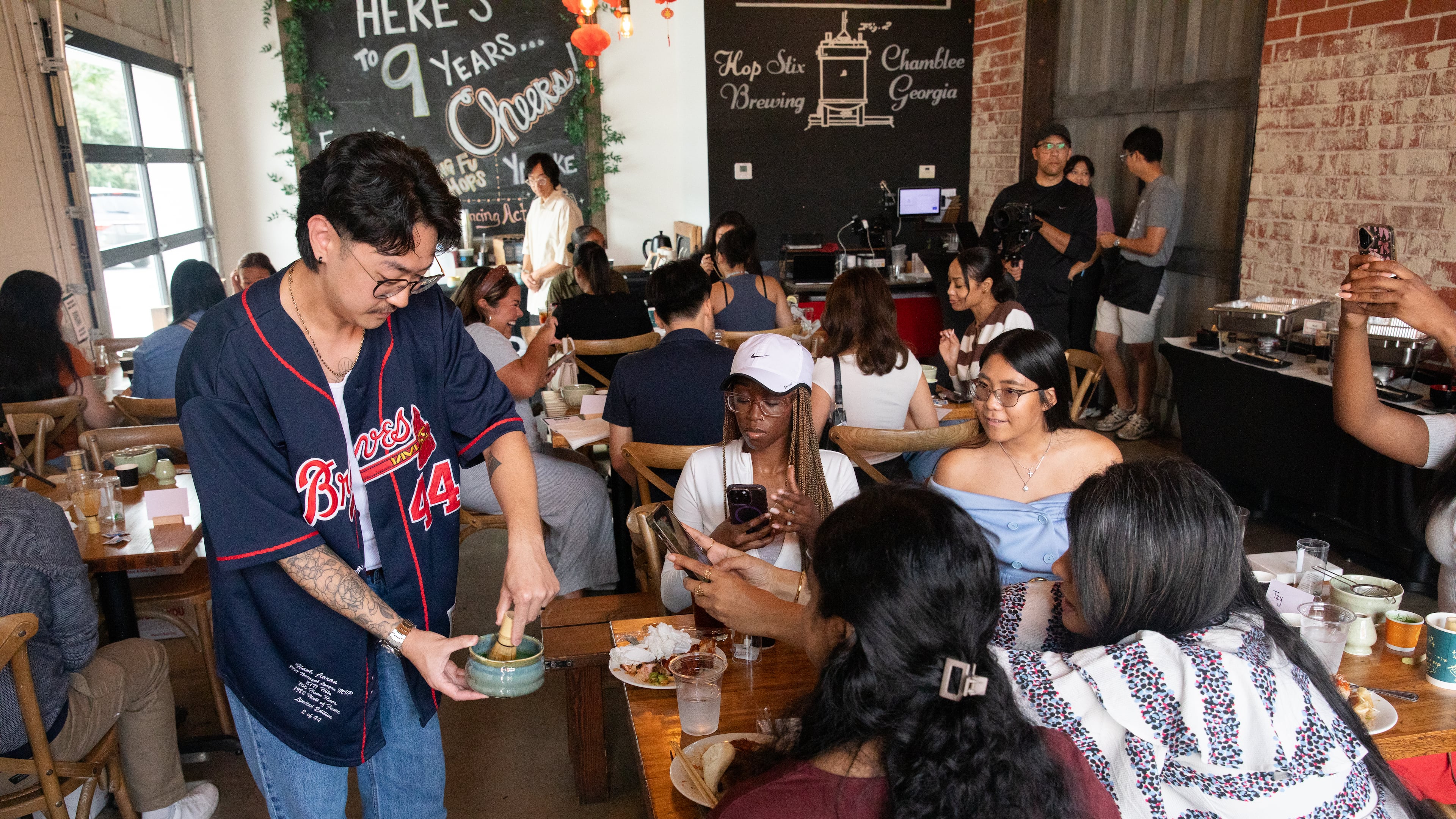 Content creators make matcha at a voter mobilization event hosted by the AAPI Victory Fund at Hopstix Brewery in Chamblee on Oct. 2, 2026. (Riley Bunch/AJC)