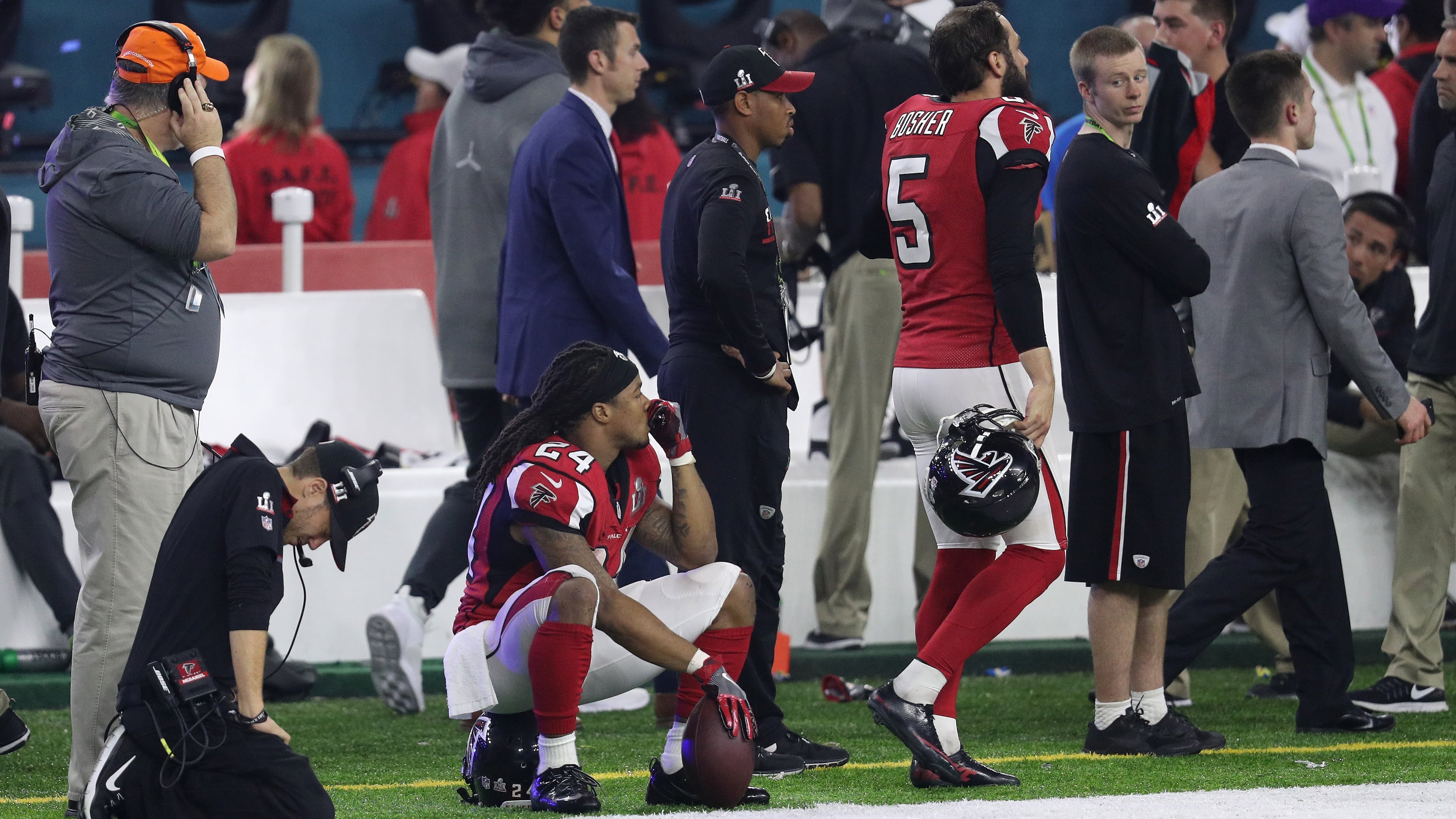 HOUSTON, TX - FEBRUARY 05: Devonta Freeman #24 of the Atlanta Falcons and Matt Bosher #5 react after losing to the New England Patriots 34-28 during Super Bowl 51 at NRG Stadium on February 5, 2017 in Houston, Texas. (Photo by Patrick Smith/Getty Images)
