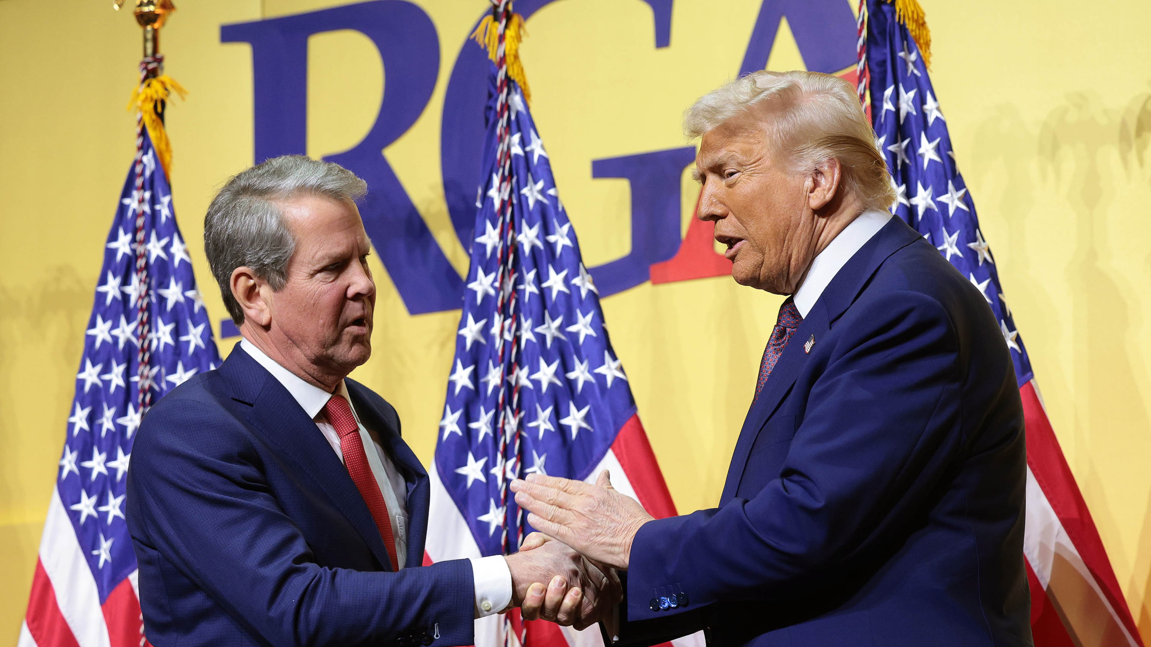 President Donald Trump, right, shakes hands with Gov. Brian Kemp, R-Ga., as he delivers remarks at the Republican Governors Association Meeting at The National Building Museum on Feb. 20, 2025, in Washington, D.C. (Win McNamee/Getty Images/TNS)