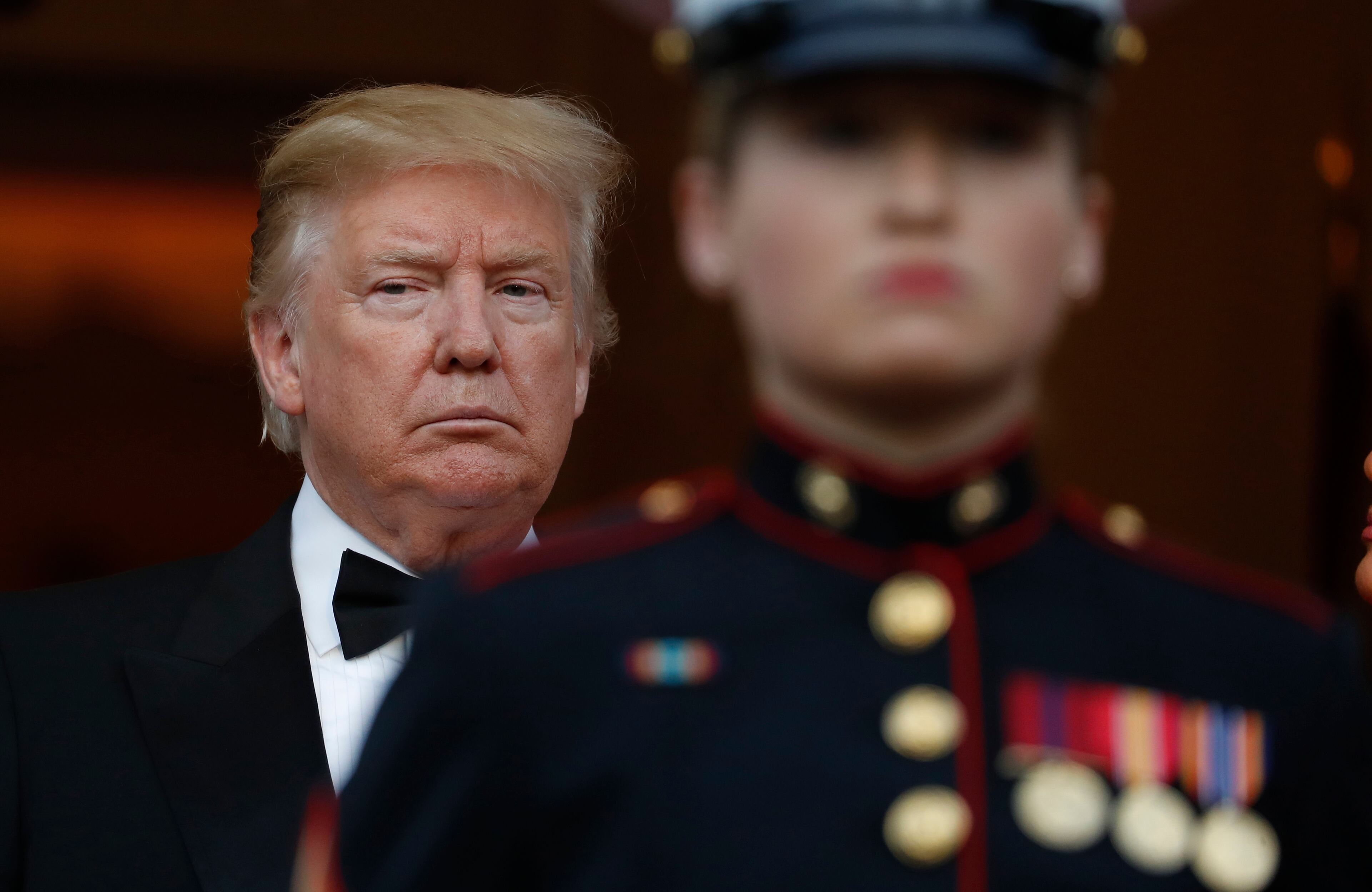 US President Donald Trump waits for the arrival Britain's Prince Charles and Camilla, Duchess of Cornwall with the first lady Melania Trump outside Winfield House in London, Tuesday, June 4, 2019. Trump is on a State visit to Britain. (AP Photo/Alastair Grant)