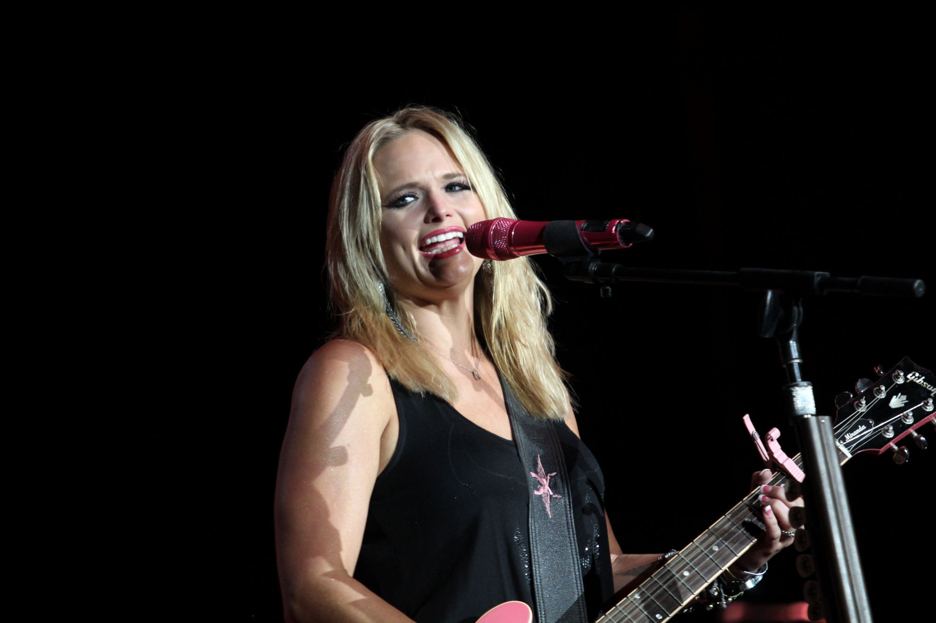 Lambert opens her performance with her hit singles "Fastest Girl in Town, "Only Prettier" and "That's the Way the World Goes "Round," at Aaron's Amphitheatre at Lakewood in Atlanta Thursday, Sept. 19, 2013.