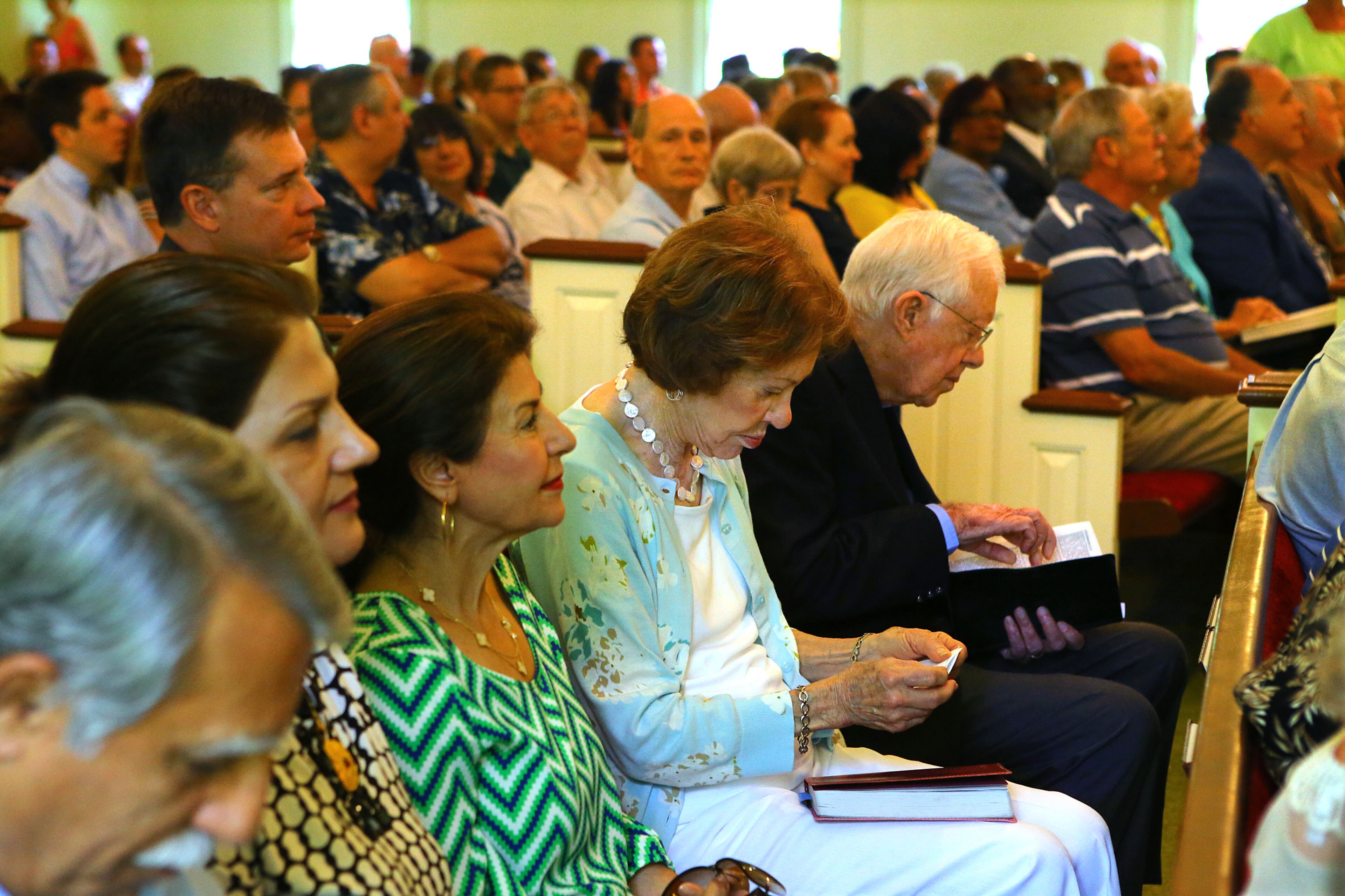 Jimmy and Rosalynn Carter prepare for Sunday worship service in their pew at Maranatha Baptist Church on Sunday, June 15, 2014, in Plains. CURTIS COMPTON / CCOMPTON@AJC.COM