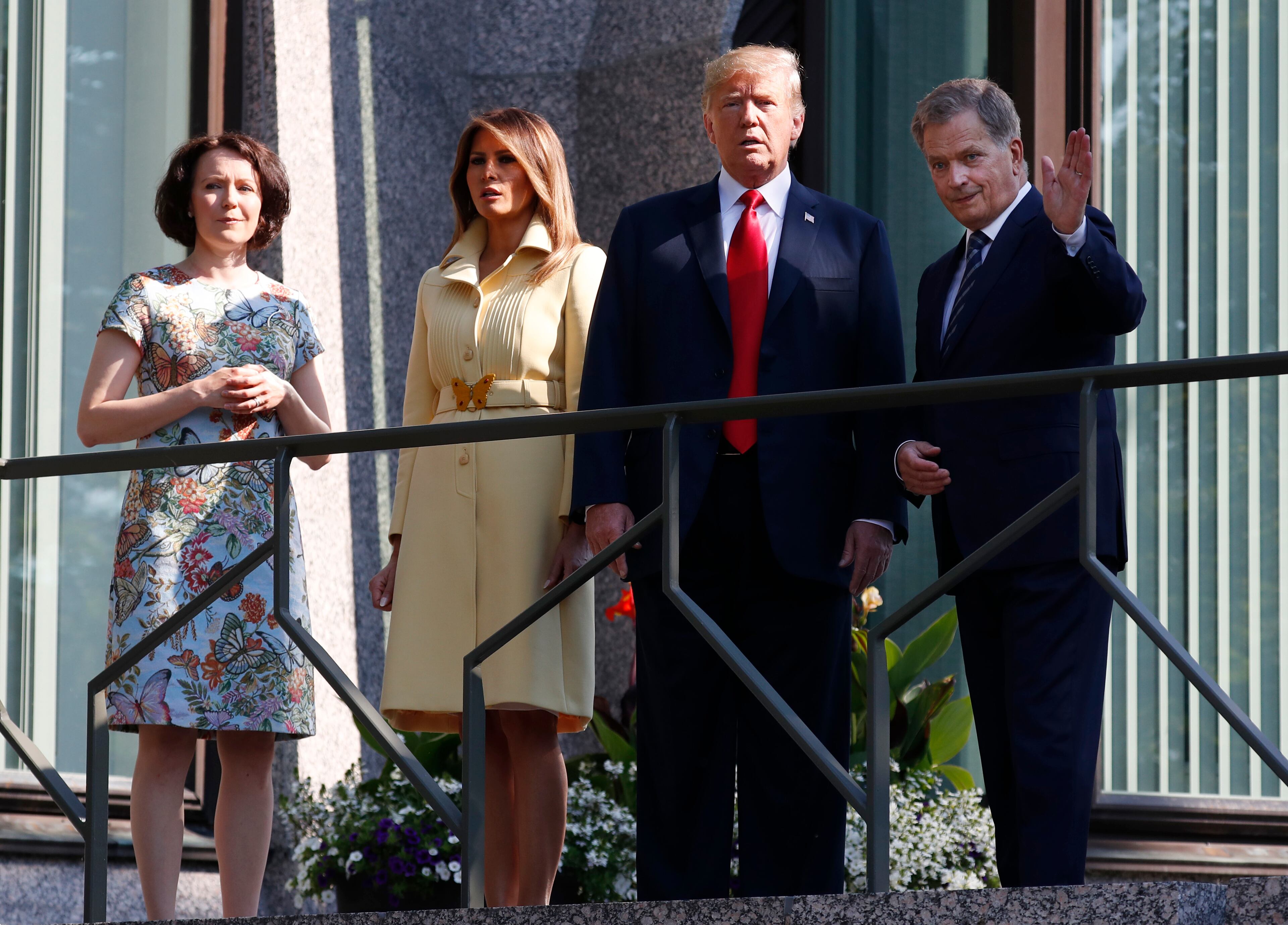 Jenni Haukio, wife of Finnish President Sauli Niinisto, U.S. First Lady Melania Trump, U.S. President Donald Trump and Finnish President Sauli Niinisto, from left, pose for a photographer of the balcony of Niinisto's official residence in Helsinki, Finland, Monday, July 16, 2018 prior to his meeting with Russian President Vladimir Putin in the Finnish capital. (AP Photo/Pablo Martinez Monsivais)