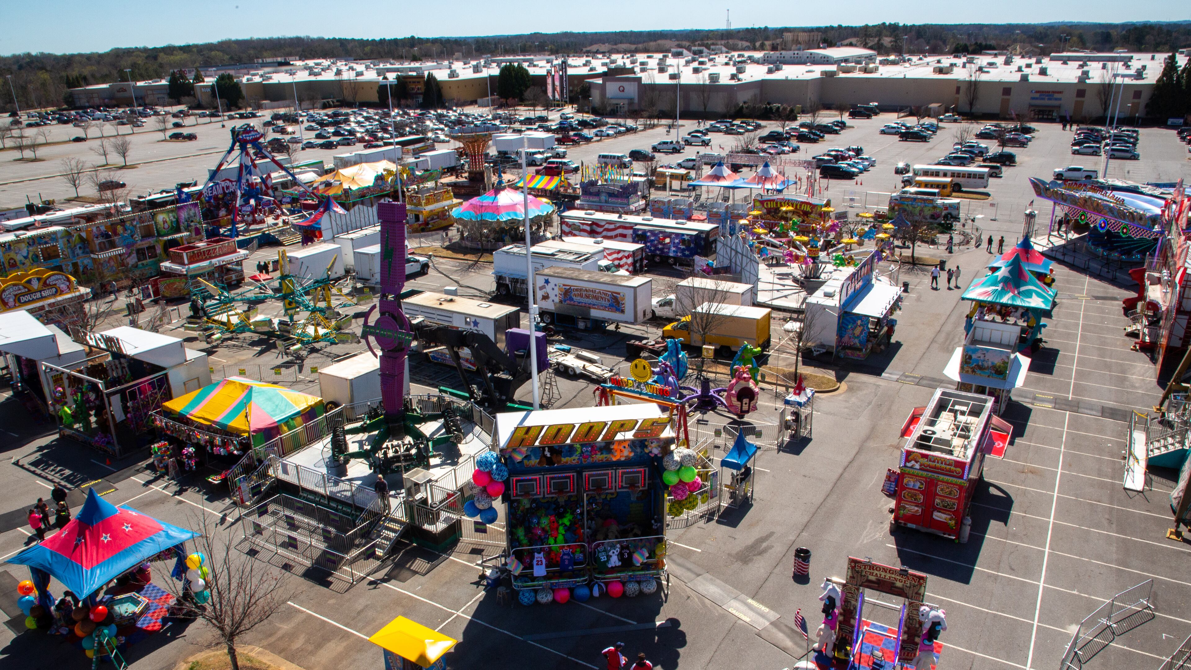 People walk around the Sugarloaf Mill Carnival in Lawrenceville Sunday, March 20, 2022. STEVE SCHAEFER FOR THE ATLANTA JOURNAL-CONSTITUTION