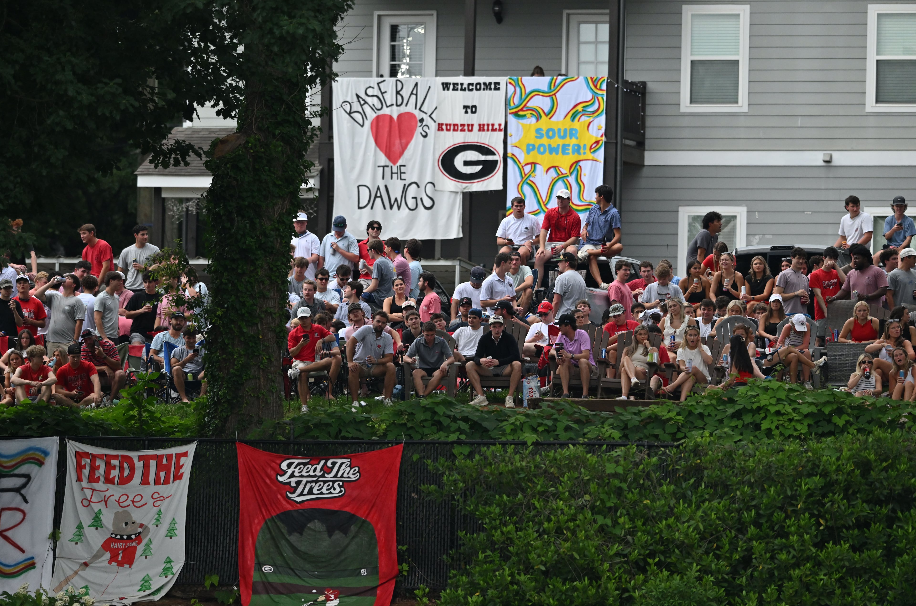 Georgia fans watch from outside the stadium fence during the second inning of the NCAA Regional game at Foley Field, Friday, May 29, 2026, in Athens. (Hyosub Shin/AJC)