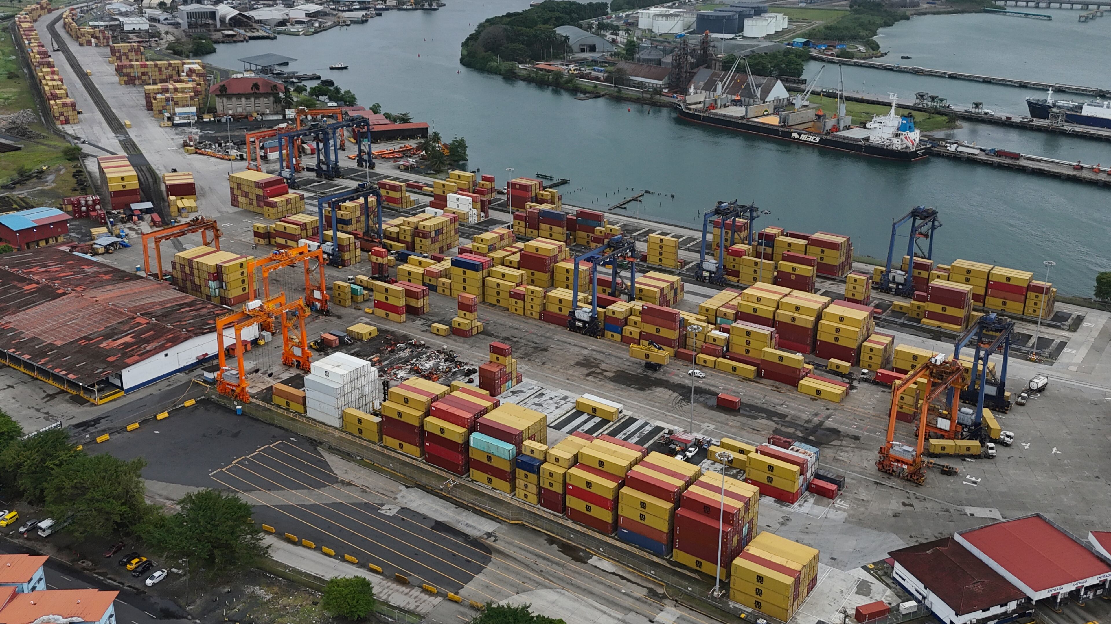 An aerial view of argo containers stacked at the Cristobal port, operated by the Panama Ports Company, in Colon, Panama, Friday, Feb. 6, 2026. (AP Photo/Matias Delacroix)