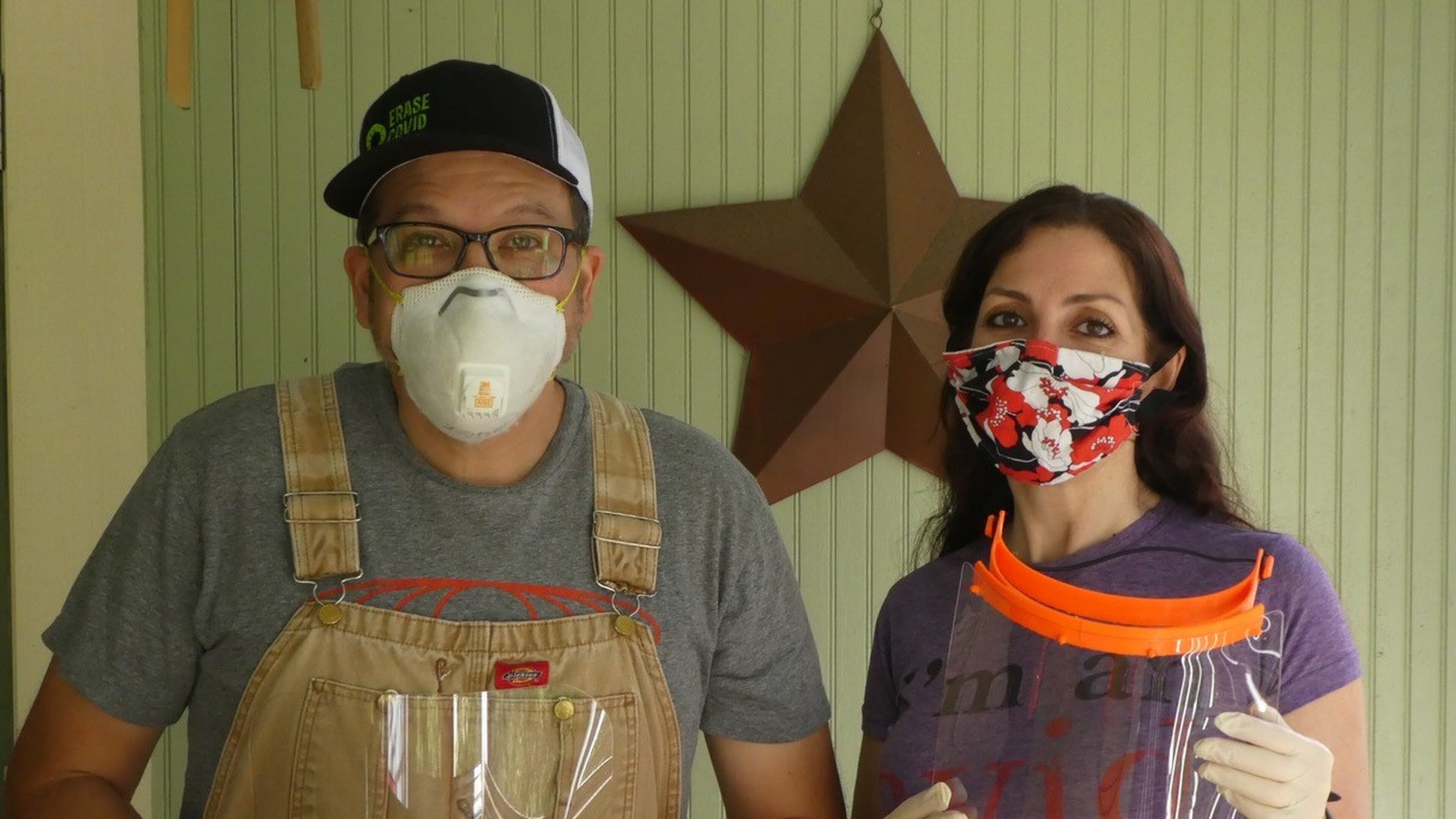 Chris and Deirdre Sugiuchi with face shields they made in their Athens home. Contributed by Deirdre Sugiuchi.