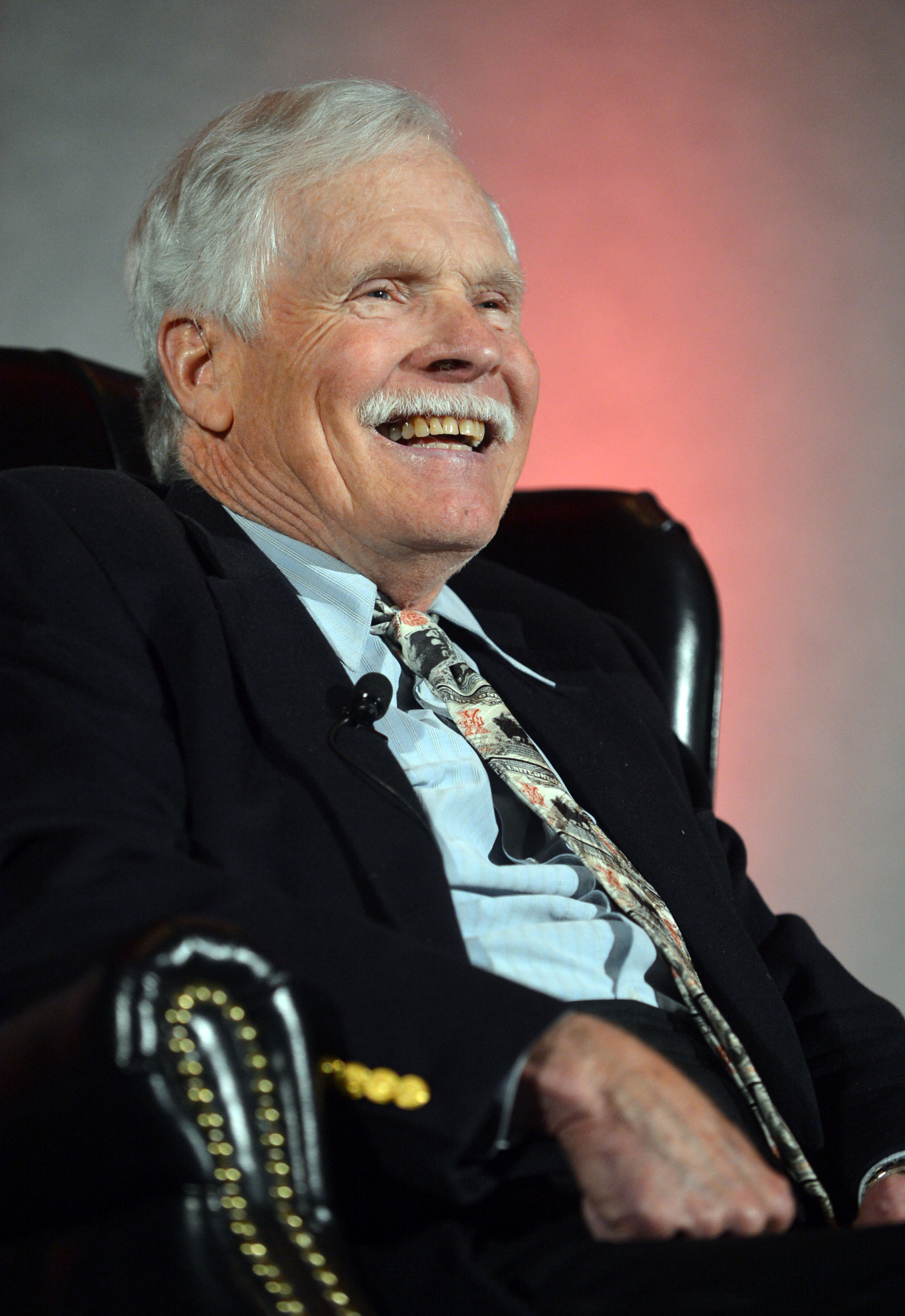 Ted Turner, back from hospitalization in South America, talks during the Technology Association of Georgia 2014 Technology Summit at the Cobb Galleria Centre Wednesday, March 26, 2014. Turner, the Atlanta billionaire and founder of Turner Broadcasting System, suffered from appendicitis while in the Patagonia region earlier this month. He underwent surgery at a hospital in Buenos Aires. On March 10, he thanked supporters and well-wishers, noting he was recuperating and “looking forward to getting back to business as usual.”