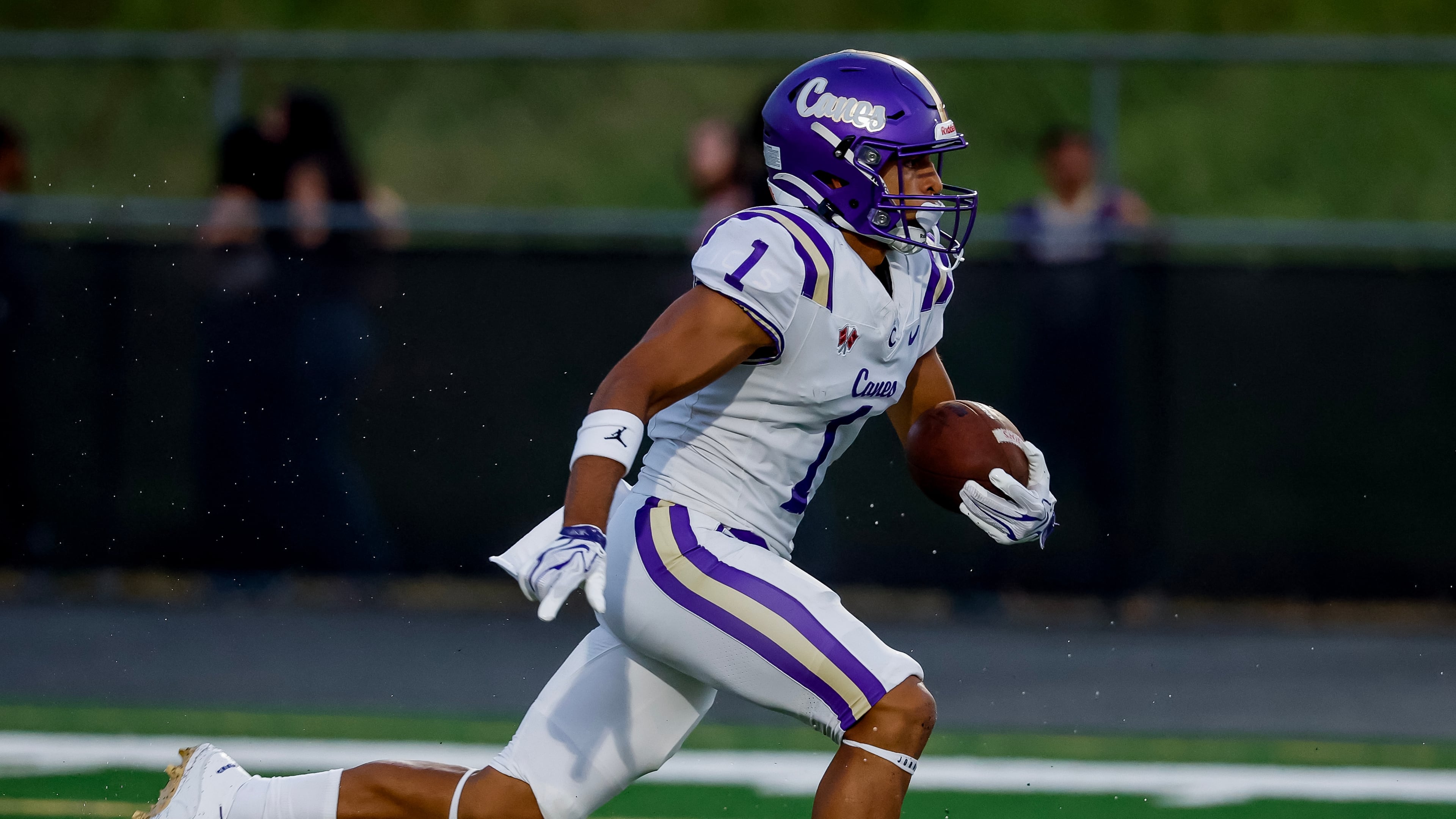 Cartersville's Madoxx Davis returns the opening kickoff against Hiram in an Aug. 21, 2026, game. Madoxx, a 5-star football recruit, was a finalist in the Clas 4A 100 meters as a sophomore last season with his 10.75-second time in the final. (Erik S. Lesser for the AJC)