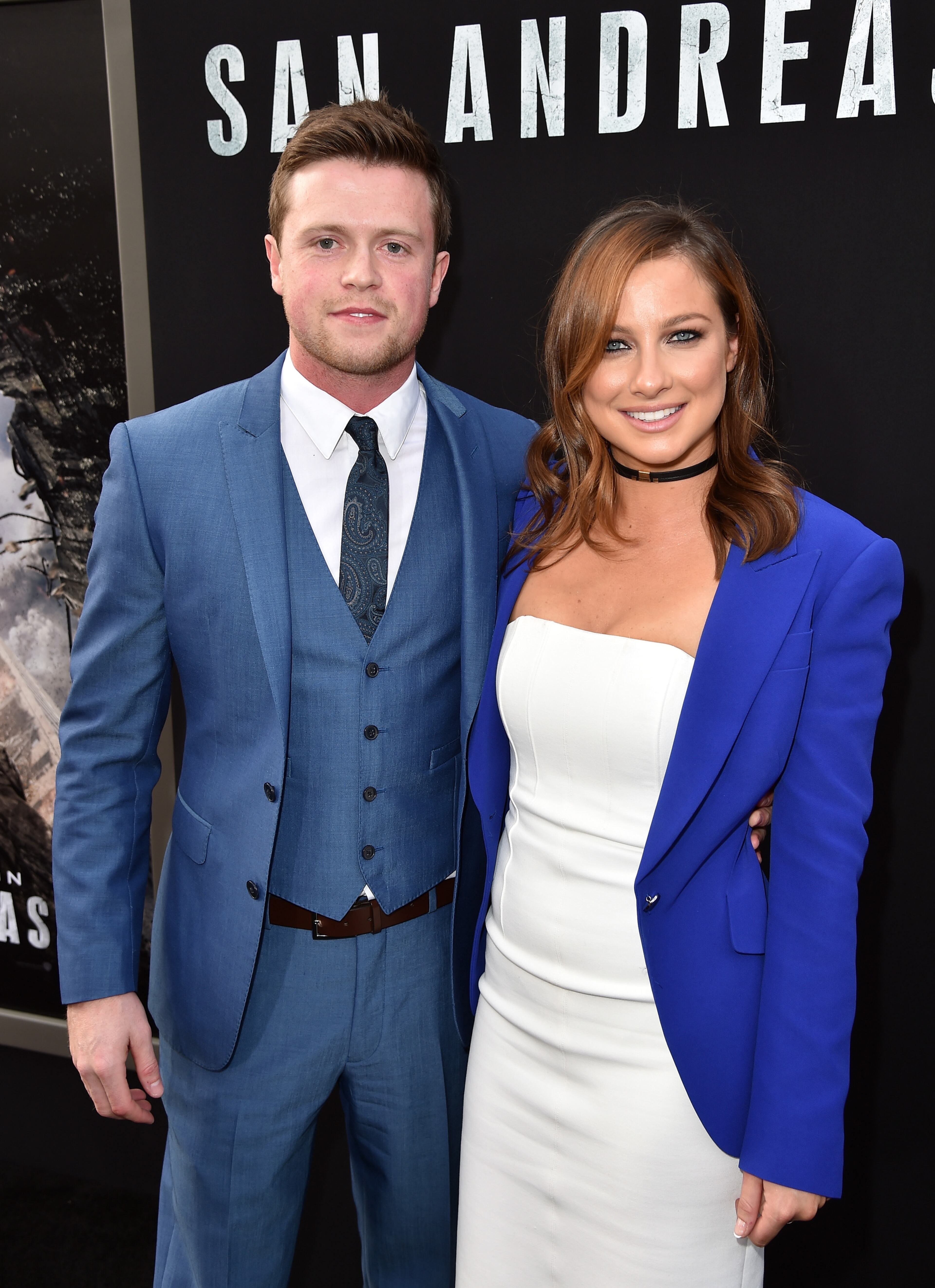 HOLLYWOOD, CA - MAY 26: Actor Hugo Johnstone-Burt (L) and Romy Poulier arrive at the premiere of Warner Bros. Pictures' "San Andreas" at TCL Chinese Theatre on May 26, 2015 in Hollywood, California. (Photo by Kevin Winter/Getty Images)