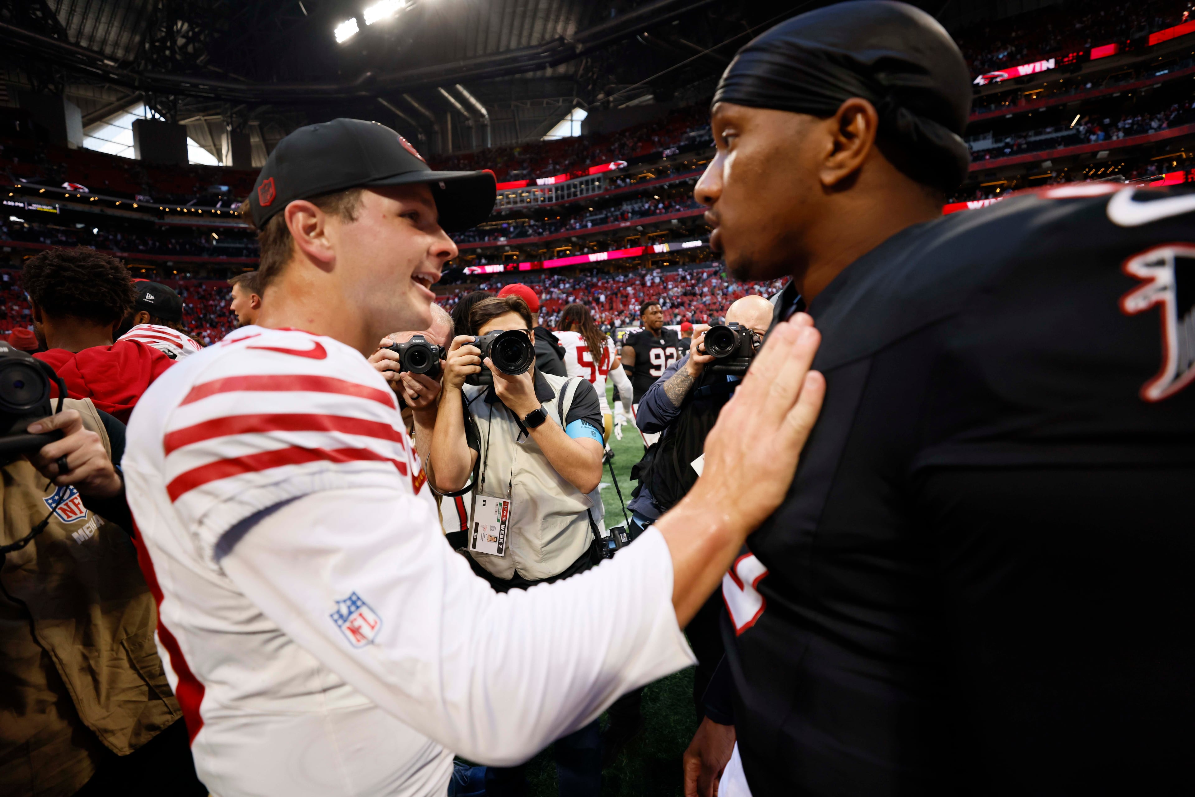 Atlanta Falcons quarterback Michael Penix Jr. (9) and San Francisco 49ers quarterback Brock Purdy (13) exchange words after the Falcons’ 29-20 win over the San Francisco 49ers at Mercedes-Benz Stadium in Atlanta, GA, on Sunday, Oct. 25, 2026. (Miguel Martinez/AJC)