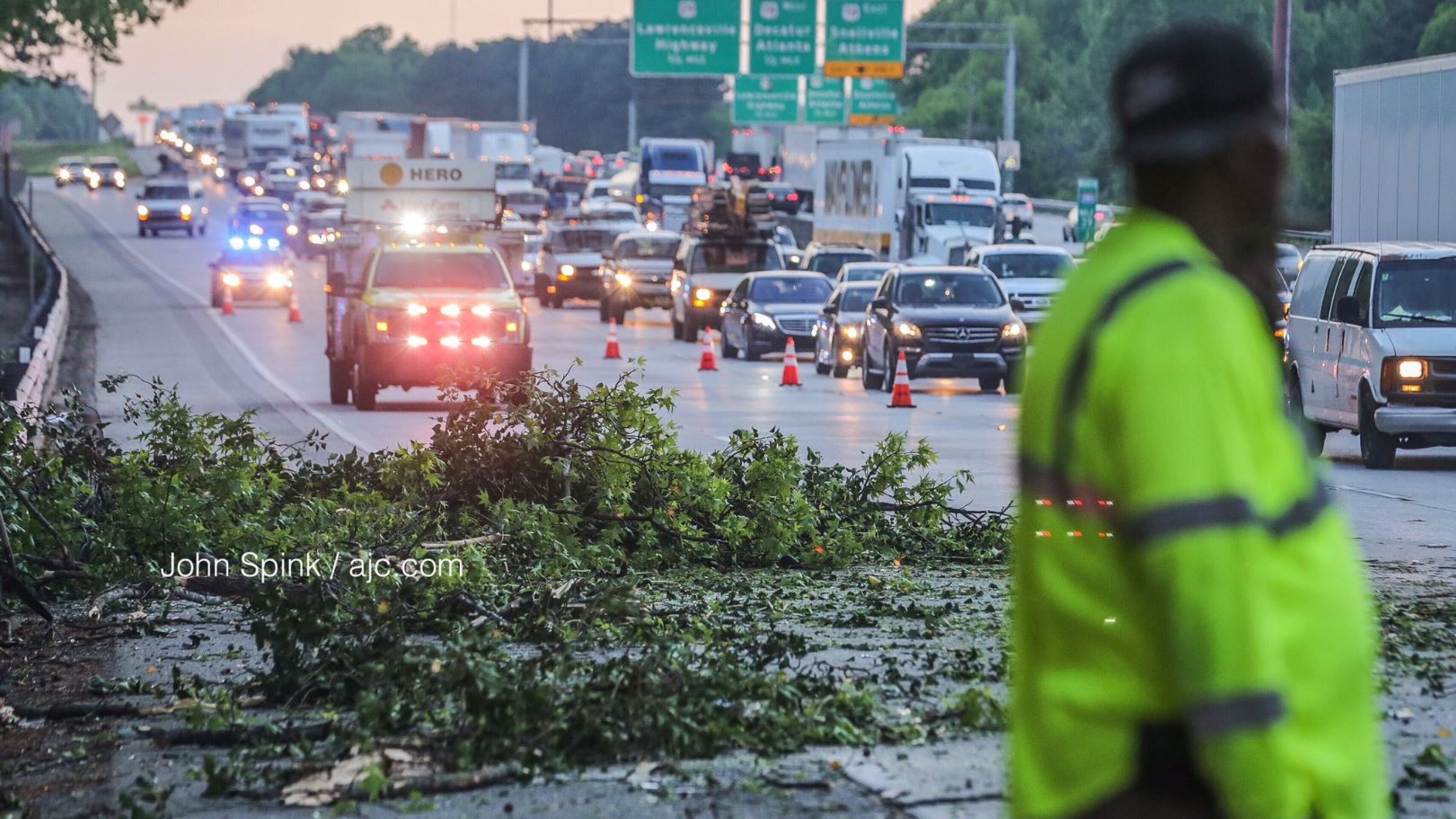 One right lane and the exit ramp to Church Street were blocked on I-285 South in DeKalb County on Thursday morning after a tree crashed through a barrier wall and landed on the interstate, hitting three vehicles on its way down.