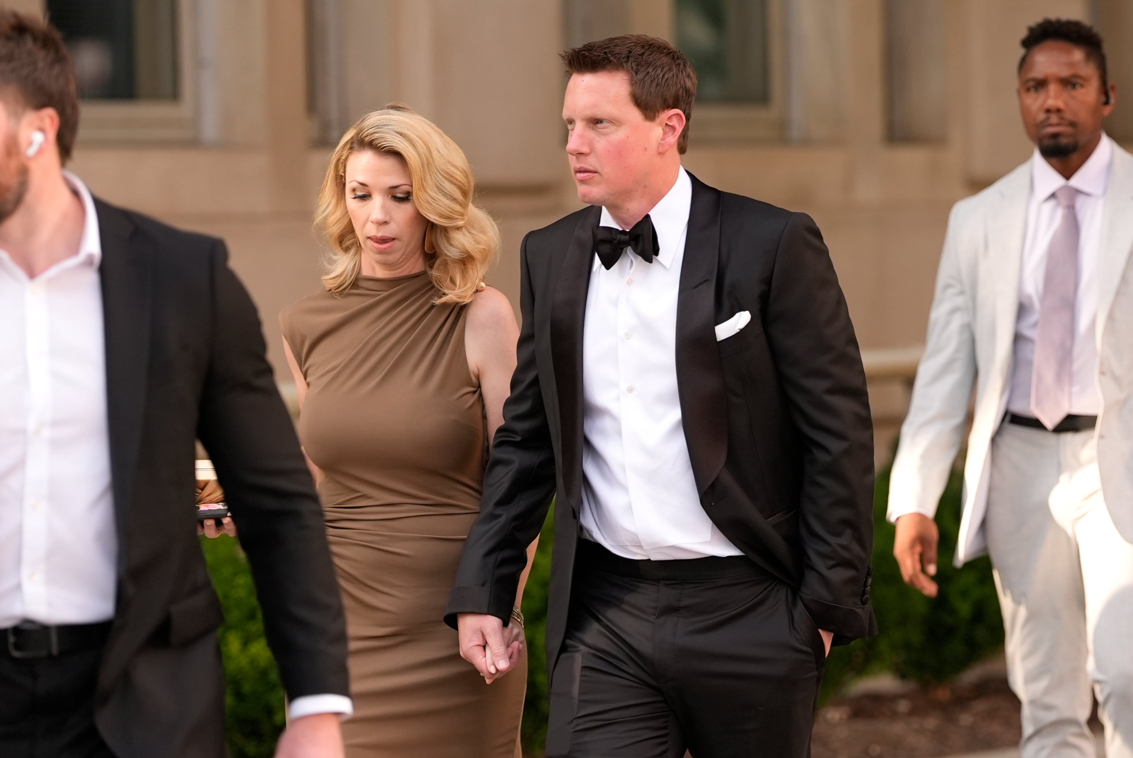 Skydance co-CEO David Ellison (right center) — pictured with his wife, Sandra Lynn Modic, in September — said of the Paramount-Warner Bros. Discovery merger: " ... our ambition was to bring these two storied studios together and create a stronger competitor, with the talent, resources, and reach to tell great stories in every genre, on every platform, for audiences everywhere. Now that ambition is a reality." (Carolyn Kaster/AP)