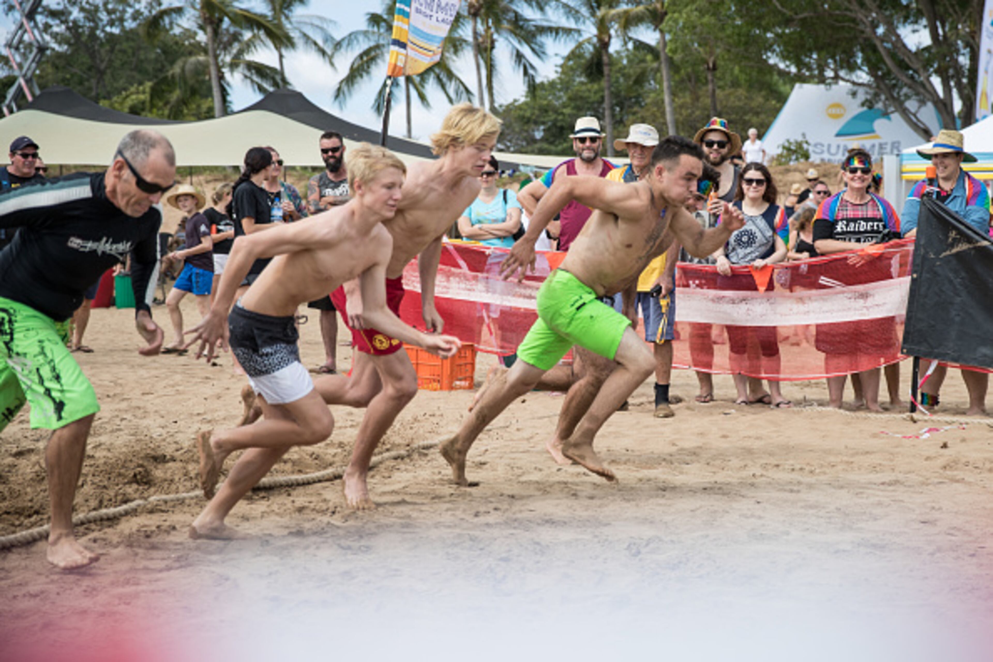 DARWIN, AUSTRALIA - JULY 09: Nick Wecker, Ryan Blenkinship and Daniel Crameri compete during the Darwin Beer Can Regatta at Mindil Beach on July 9, 2017 in Darwin, Australia. The annual event first started in 1974 as a way to clean up beer cans littering local streets. The all-day event includes boat races alongside thong throwing and sandcastle competitions. (Photo by Helen Orr/Getty Images)