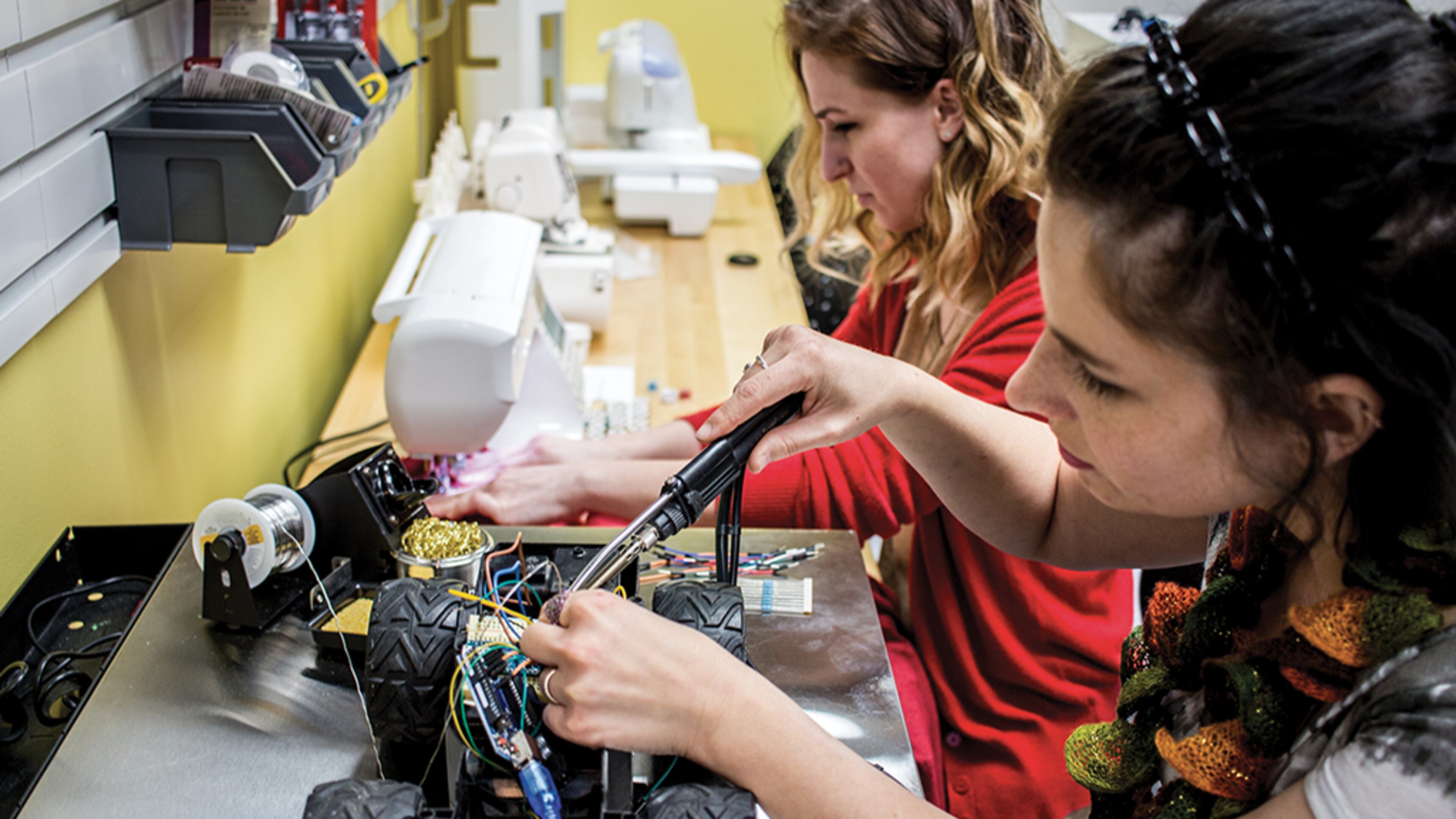 Two women work at a makerspace in Dayton, Ohio. Roswell hopes to open its makerspace within two months.