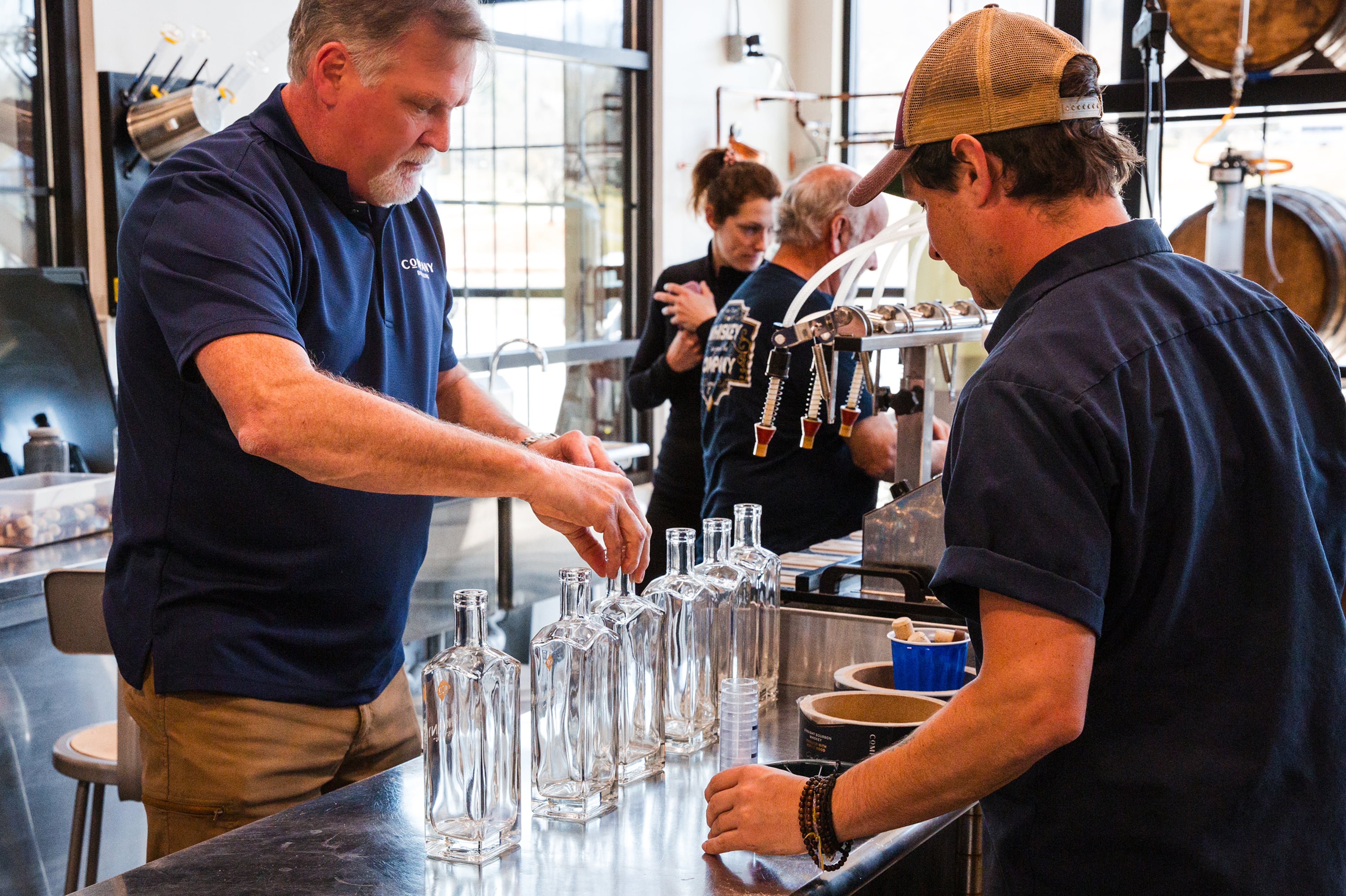 Jeff Arnett invites visitors to pour their own bottle of Tennessee whiskey in the bottling room in Townsend, TN. (Courtesy of Leonard Garrison)