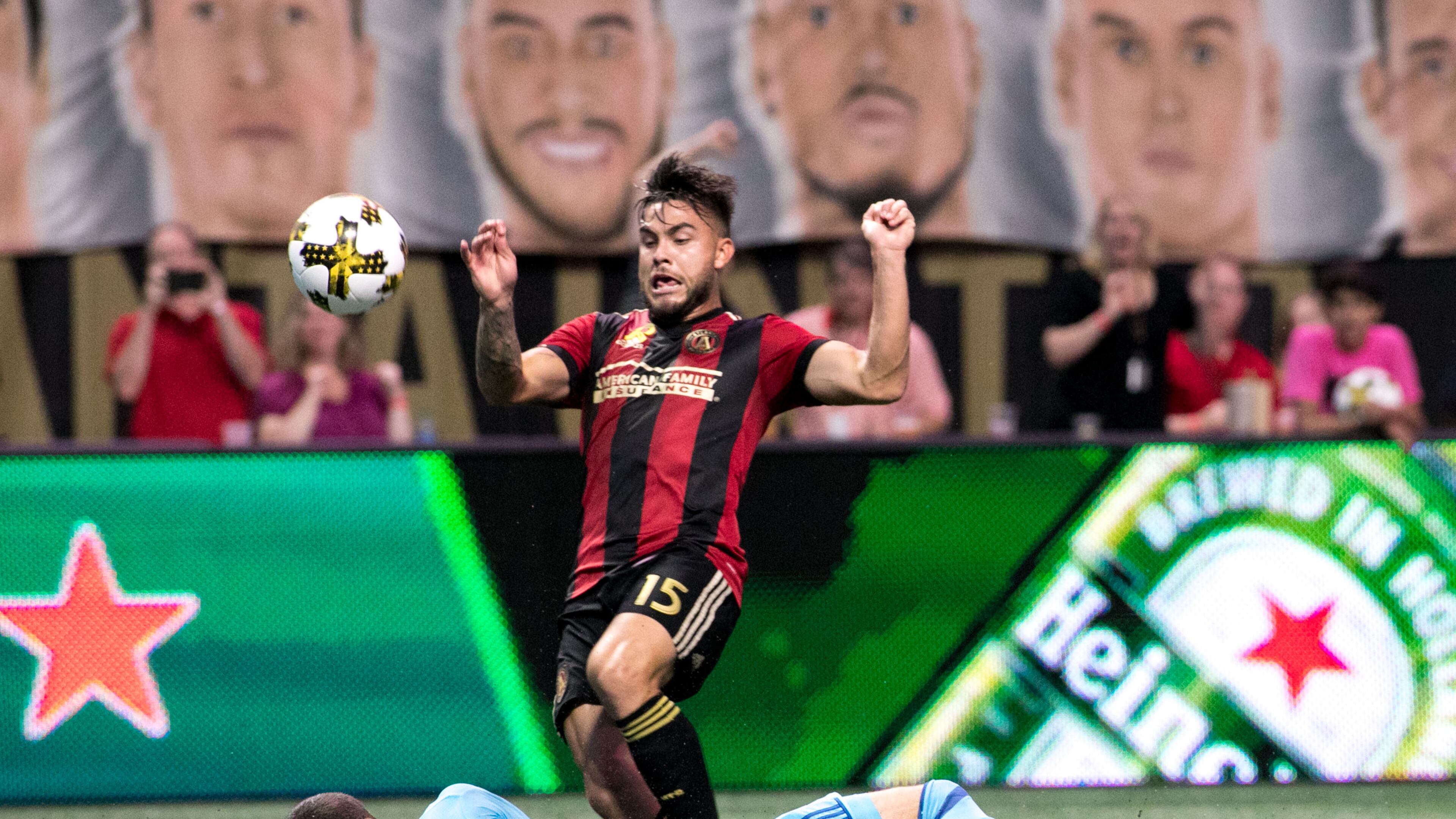 Atlanta United forward Hector Villalba (15) kicks the ball over Montreal Impact goalkeeper Evan Bush (1) during the second half of a MLS soccer game at Mercedes-Benz Stadium, Sunday, Sept. 24, 2017, in Atlanta. BRANDEN CAMP/SPECIAL