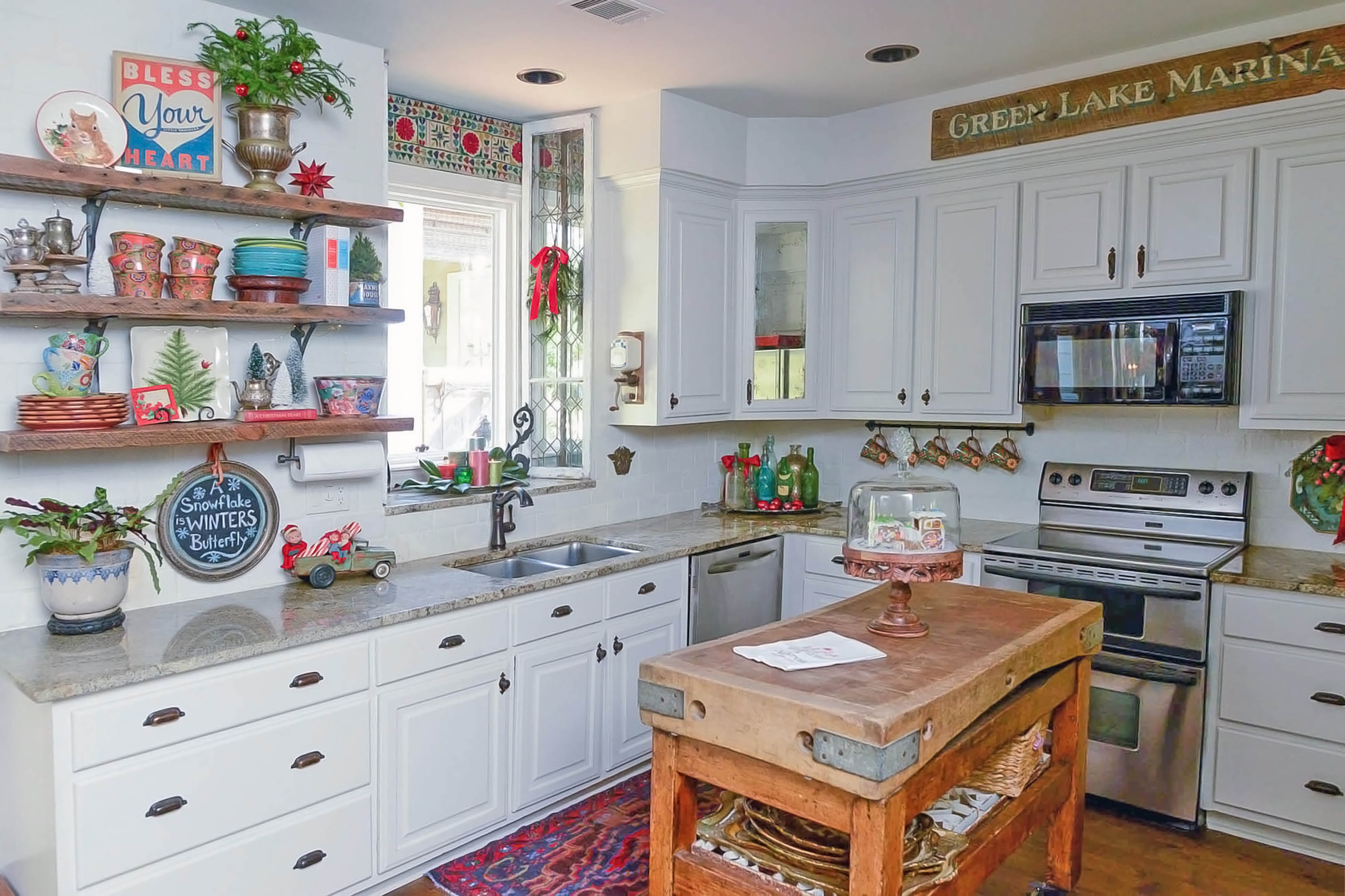 Cabinets and open shelving are key elements in the kitchen.