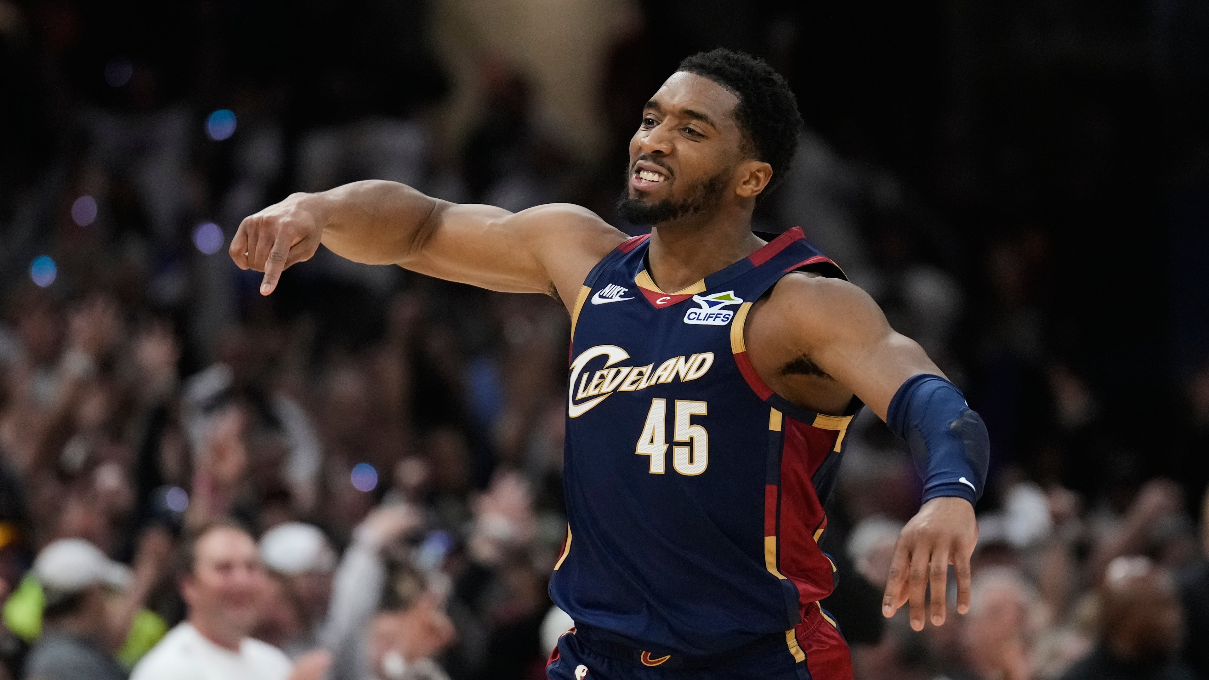 Cleveland Cavaliers' Donovan Mitchell (45) gestures after hitting a three-point basket inthe second half of Game 4 of a second-round NBA basketball playoff series against the Detroit Pistons Monday, May 11, 2026, in Cleveland. (AP Photo/Sue Ogrocki)