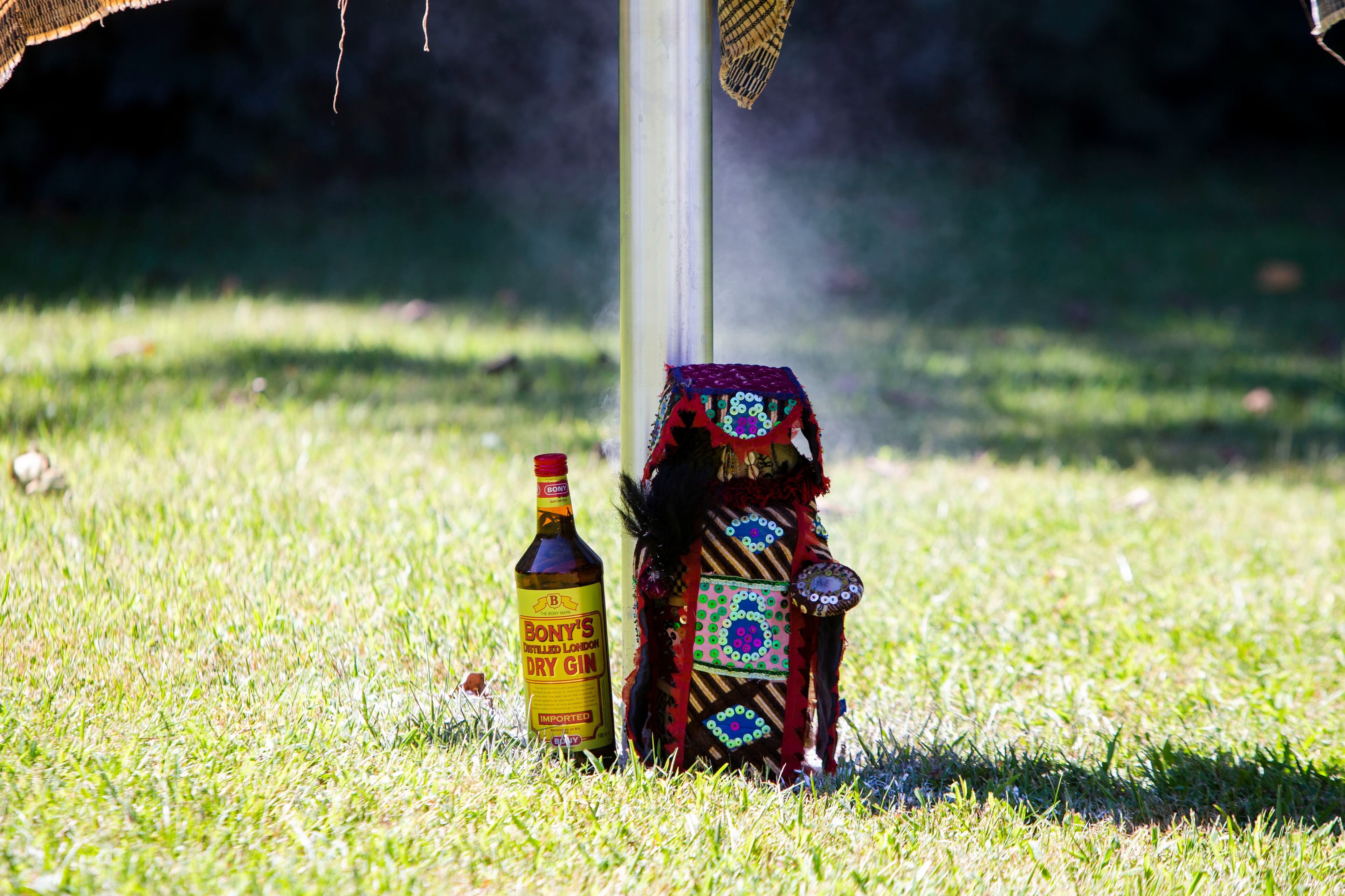 Ceremonial objects sit at the base of a historical marker for Zeb Long, a lynching victim from the 1906 Atlanta Race Massacre, on Saturday, September 24, 2022, at Sumner Park in East Point. The event was held by the Fulton County Remembrance Coalition. CHRISTINA MATACOTTA FOR THE ATLANTA JOURNAL-CONSTITUTION
