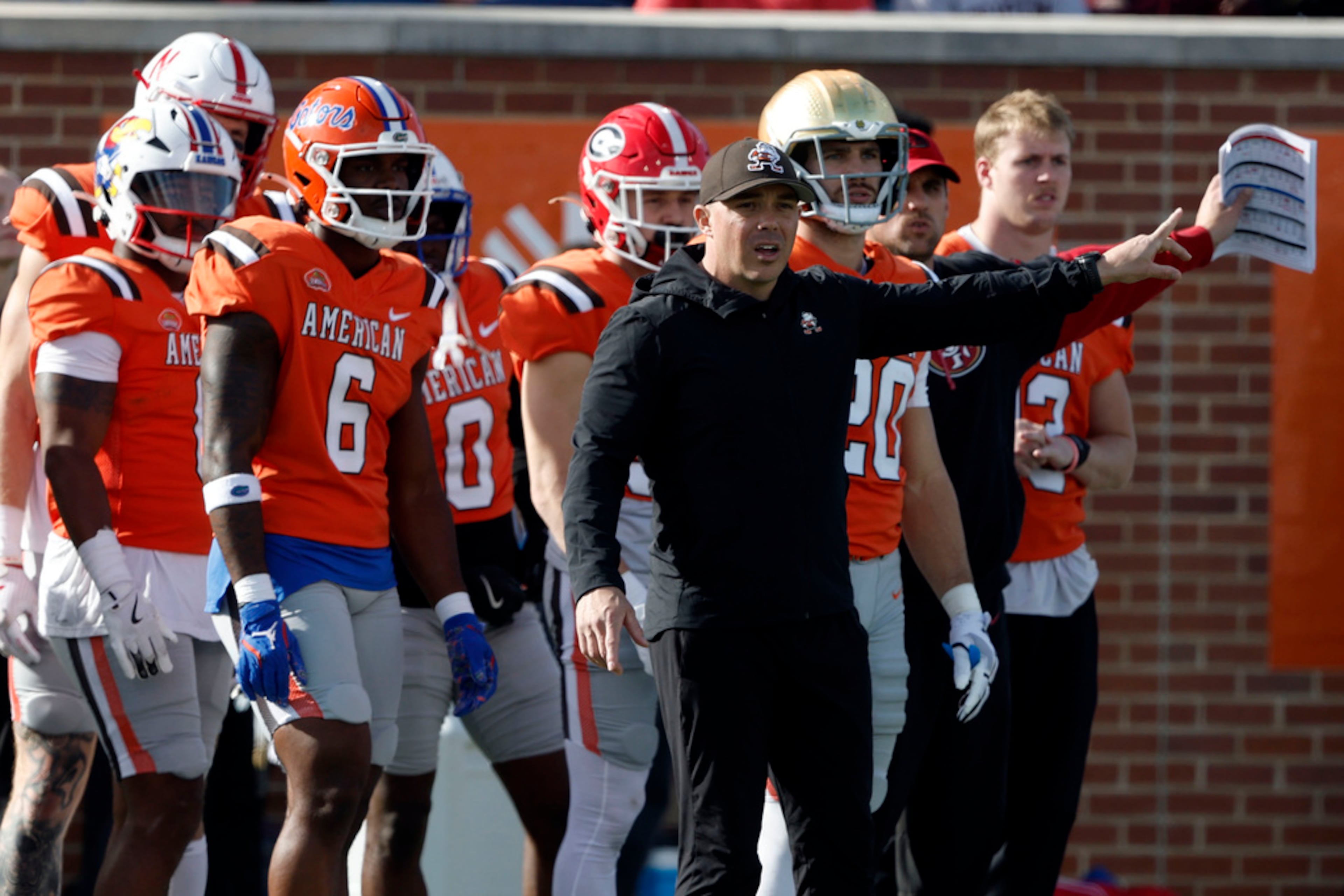 American team head coach Bubba Ventrone, front right, of the Cleveland Browns, reacts after a play during the first half of the Senior Bowl NCAA college football game against the National team Saturday, Feb. 1, 2025, in Mobile, Ala. (AP Photo/Butch Dill)