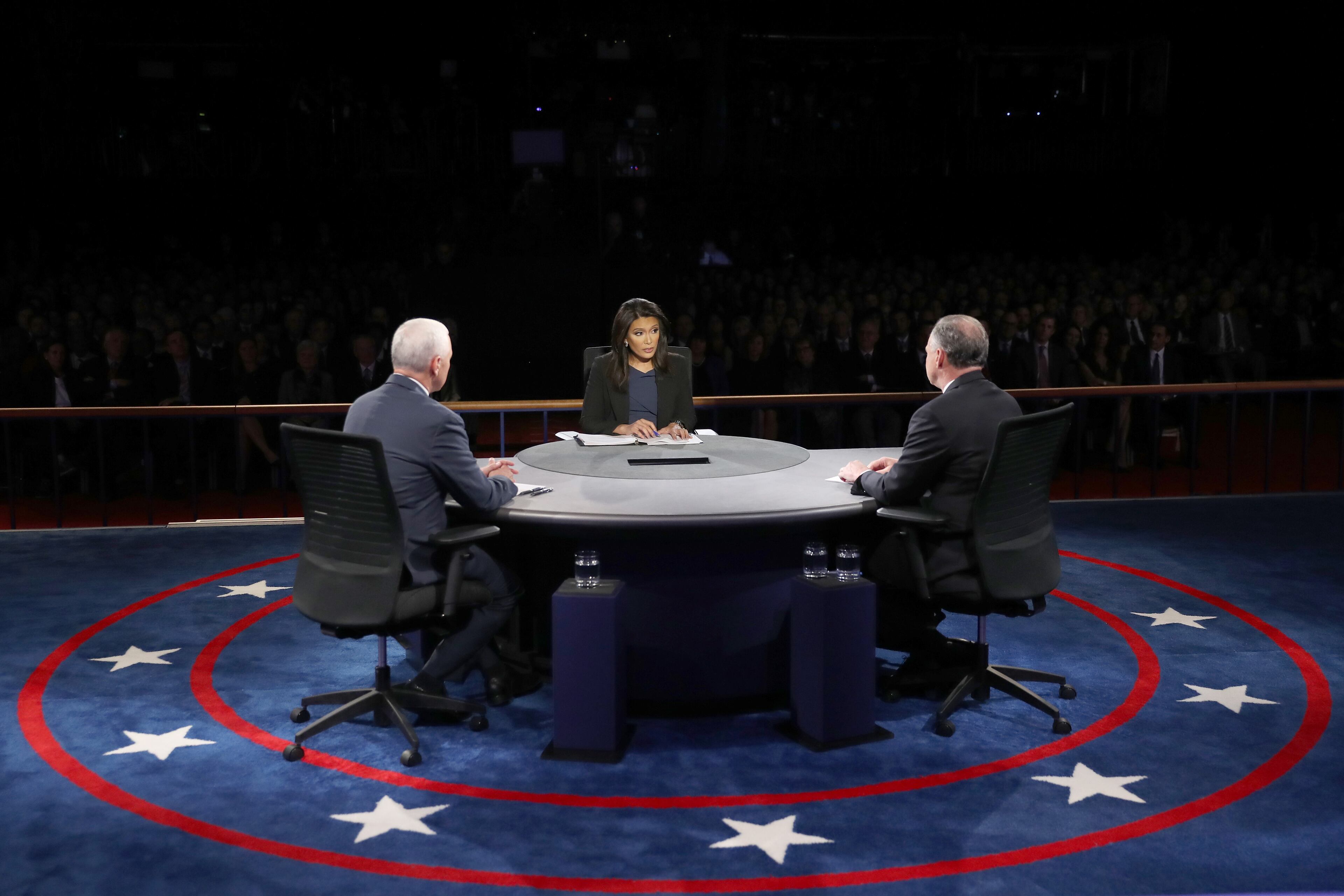 Republican vice presidential nominee Mike Pence (L) and Democratic vice presidential nominee Tim Kaine (R) listen as debate moderator Elaine Quijano (C) speaks during the debate at Longwood University on Oct. 4, 2016 in Farmville, Virginia. This is the second of four debates during the presidential election season and the only debate between the vice presidential candidates. (Photo by Joe Raedle/Getty Images)