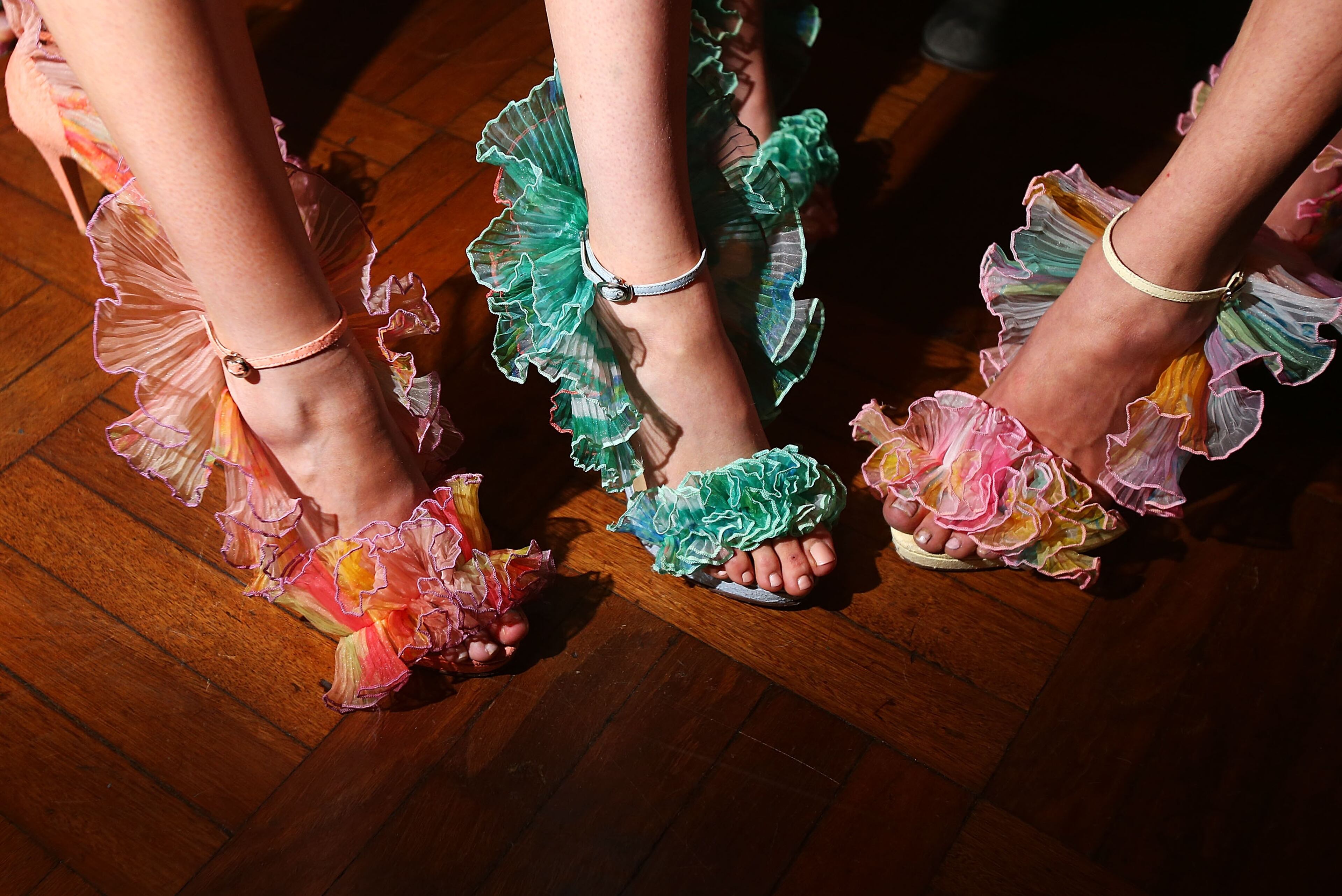 Models pose for photos backstage ahead of the MBFWA Trends show during the Mercedes-Benz Fashion Festival Sydney 2013 at Sydney Town Hall on Aug. 21, 2013, in Sydney, Australia.