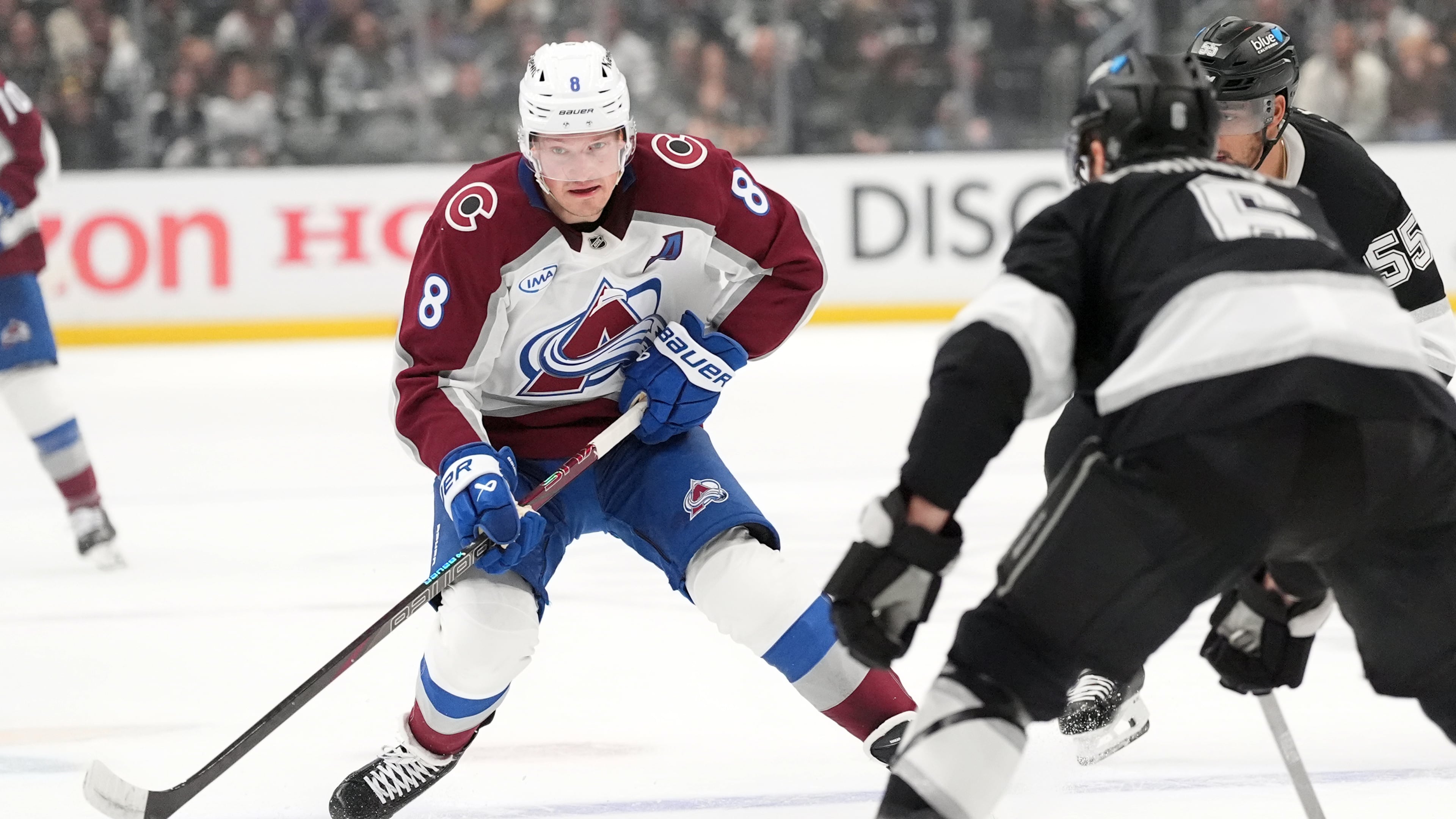 Colorado Avalanche's Cale Makar (8) brings the puck across the blue line against Los Angeles Kings during the first period of Game 4 in the first round of an NHL hockey Stanley Cup playoff series Sunday, April 26, 2026, in Los Angeles. (AP Photo/Scott Strazzante)