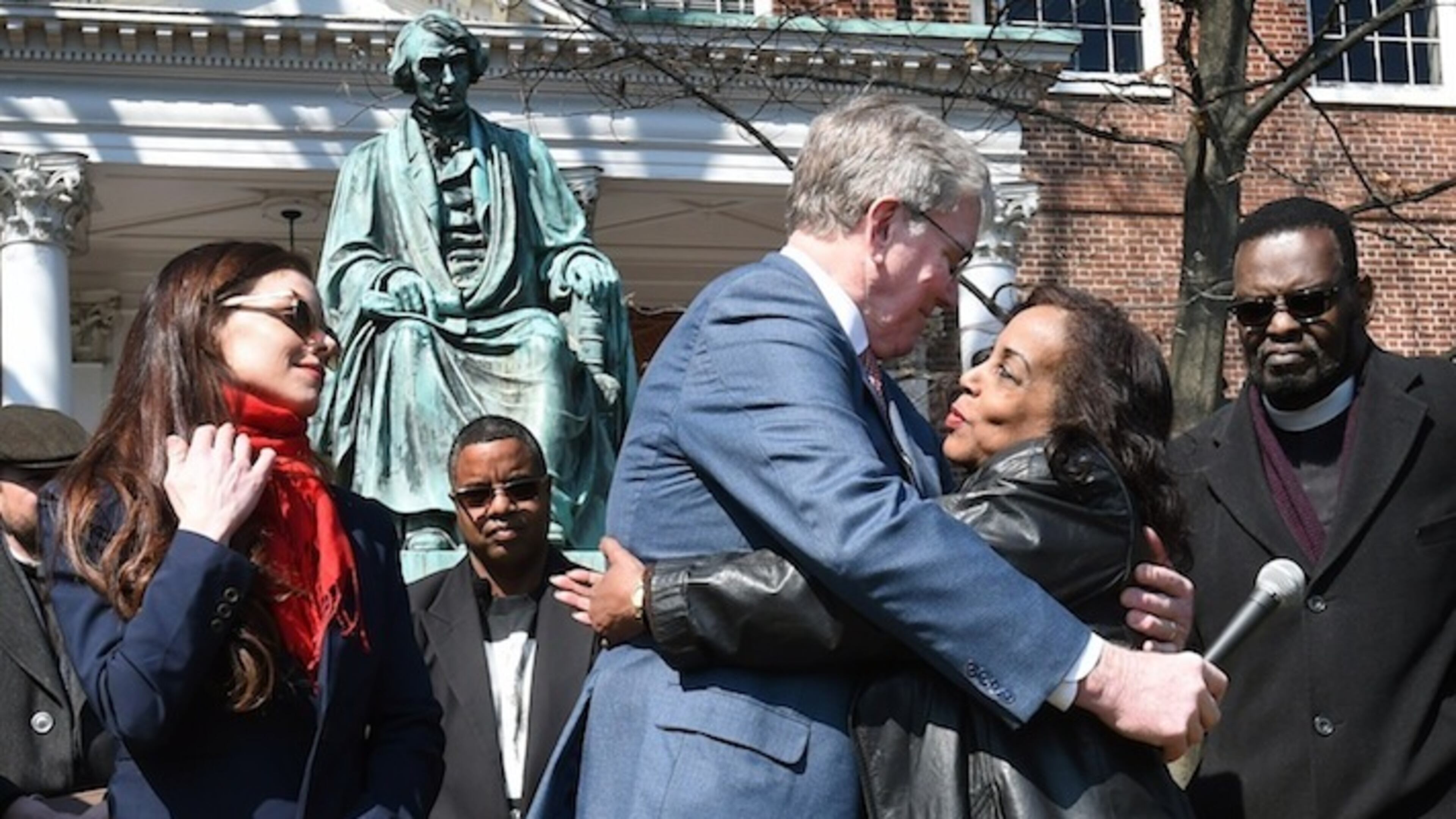 Lynne Jackson, right, great great granddaughter of Dred Scott, hugs Charles Taney III, a descendant of U.S. Supreme Court Chief Justice Roger Taney, after their reconciliation. On left, is Charles Taney's daughter Kate Taney-Billingsley, who wrote a play of a fictional meeting of the descendants, which created the opportunity for the actual meeting. (Kenneth K. Lam/Baltimore Sun/TNS)