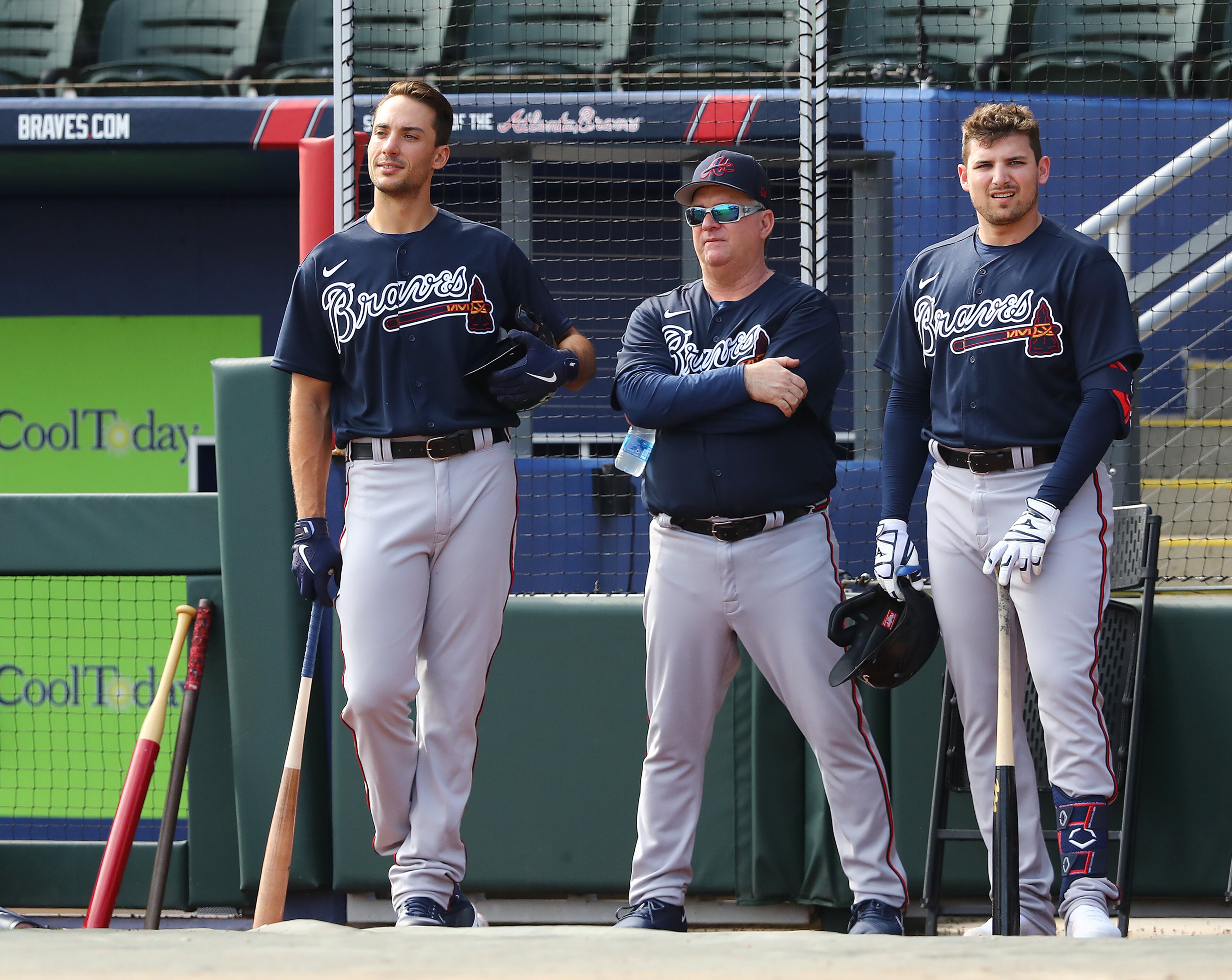 031622 North Port: Atlanta Braves first baseman Matt Olson (from left), hitting coach Kevin Seitzer, and third baseman Austin Riley watch pitcher Dylan Lee throw live batting practice during Spring Training at CoolToday Park on Wednesday, March 16, 2022, in North Port. “Curtis Compton / Curtis.Compton@ajc.com”
