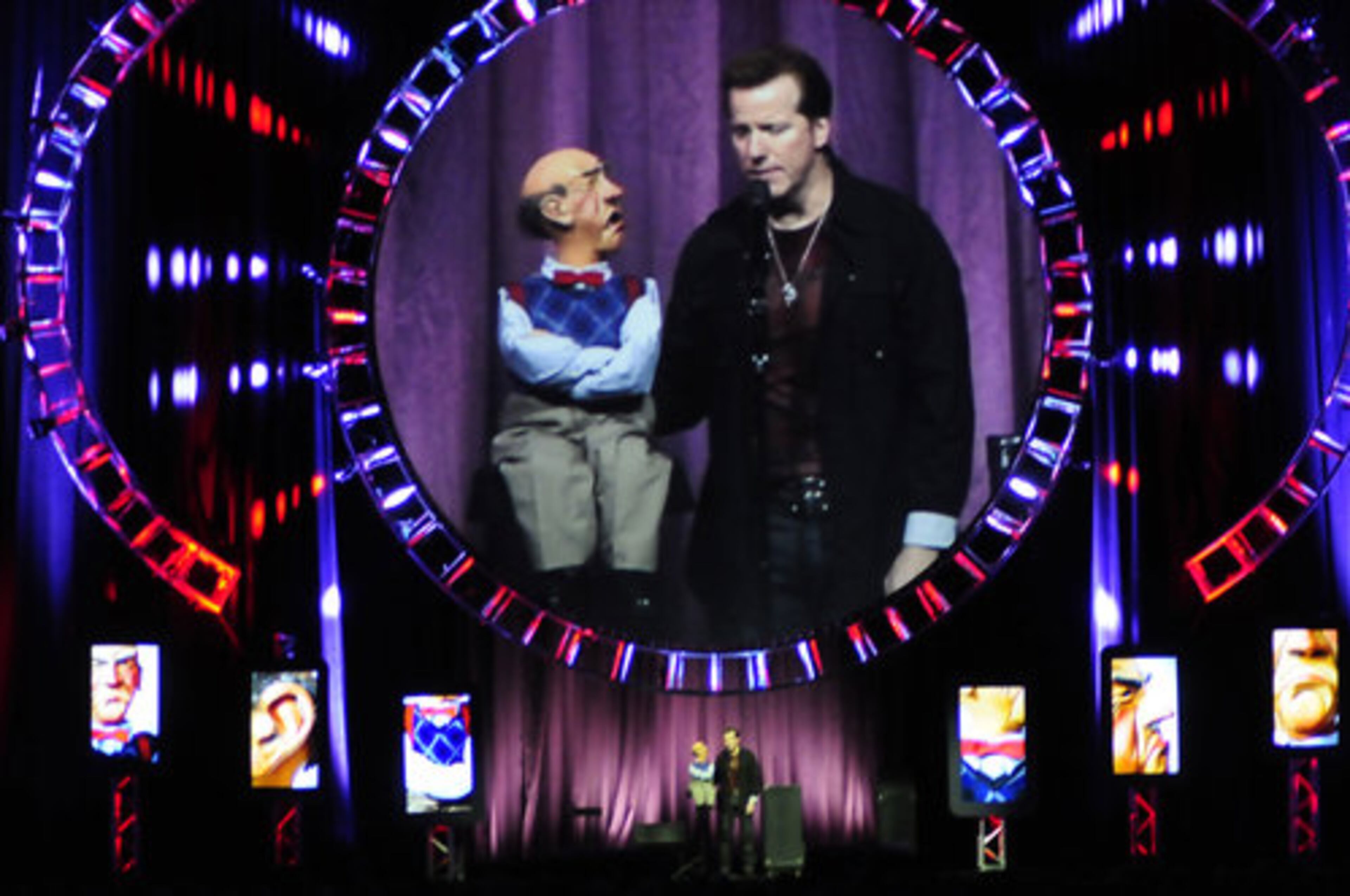 Jeff Dunham and his dummy Walter are projected on a screen above them for those seated further back at Philips Arena. The show sold out the downtown arena.