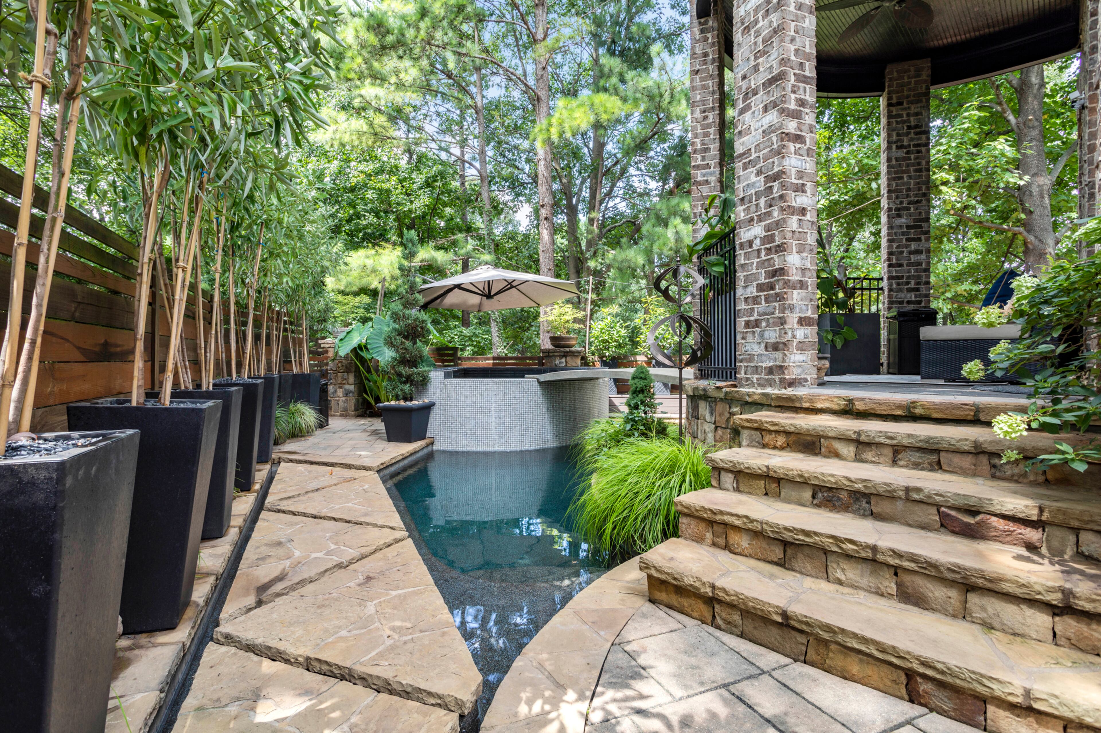 Dreamy resort-style exterior with heated pool & spa. Text by Justin Longenbach