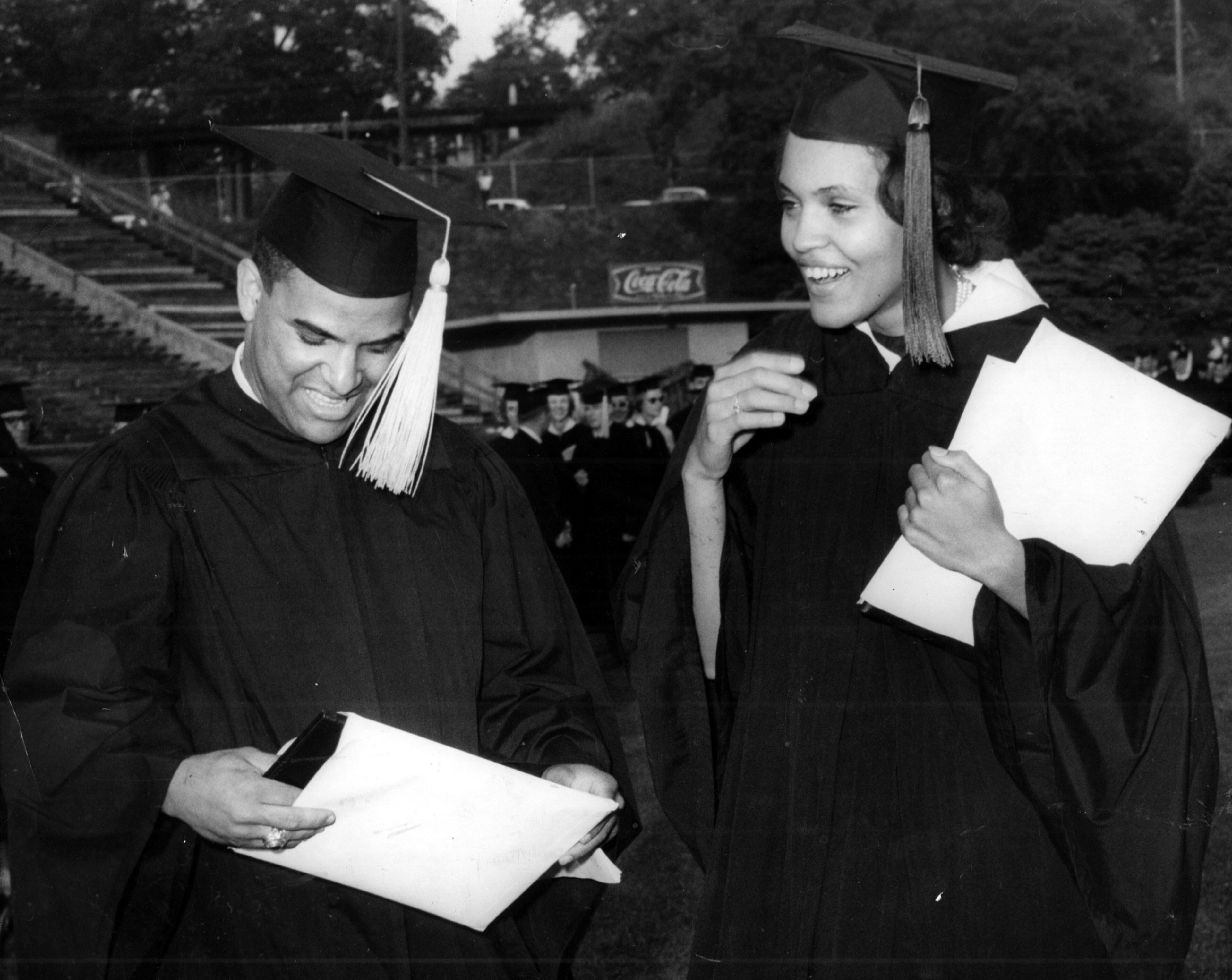 Hamilton Holmes and Charlayne Hunter examine diplomas awarded during the University of Georgia's 160th commencement in Athens on June 2, 1963. (AP)