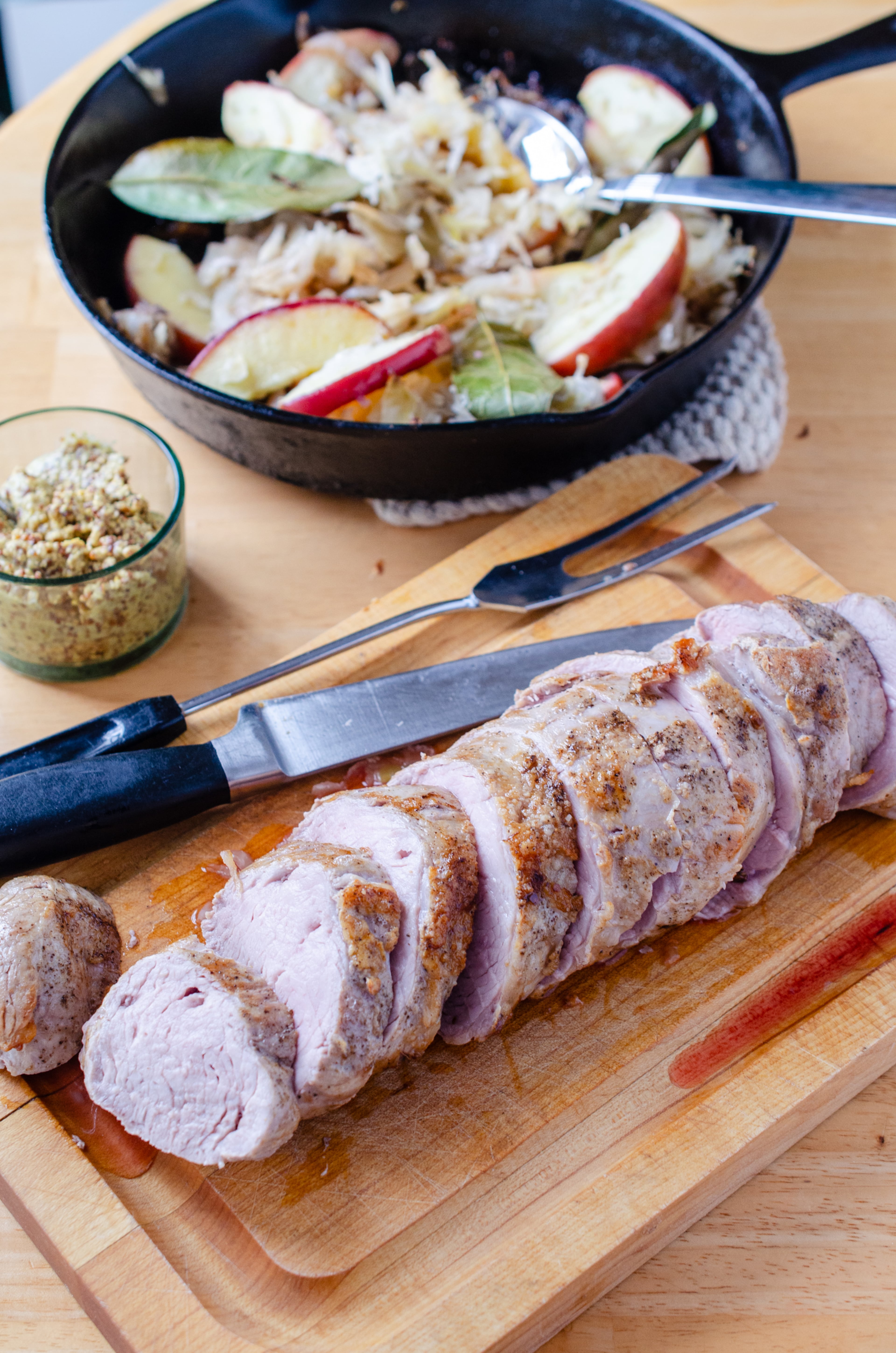 Pork Tenderloin with Apple-Herb Sauerkraut is meaty and satisfying for a weeknight supper. (Virginia Willis for the AJC)