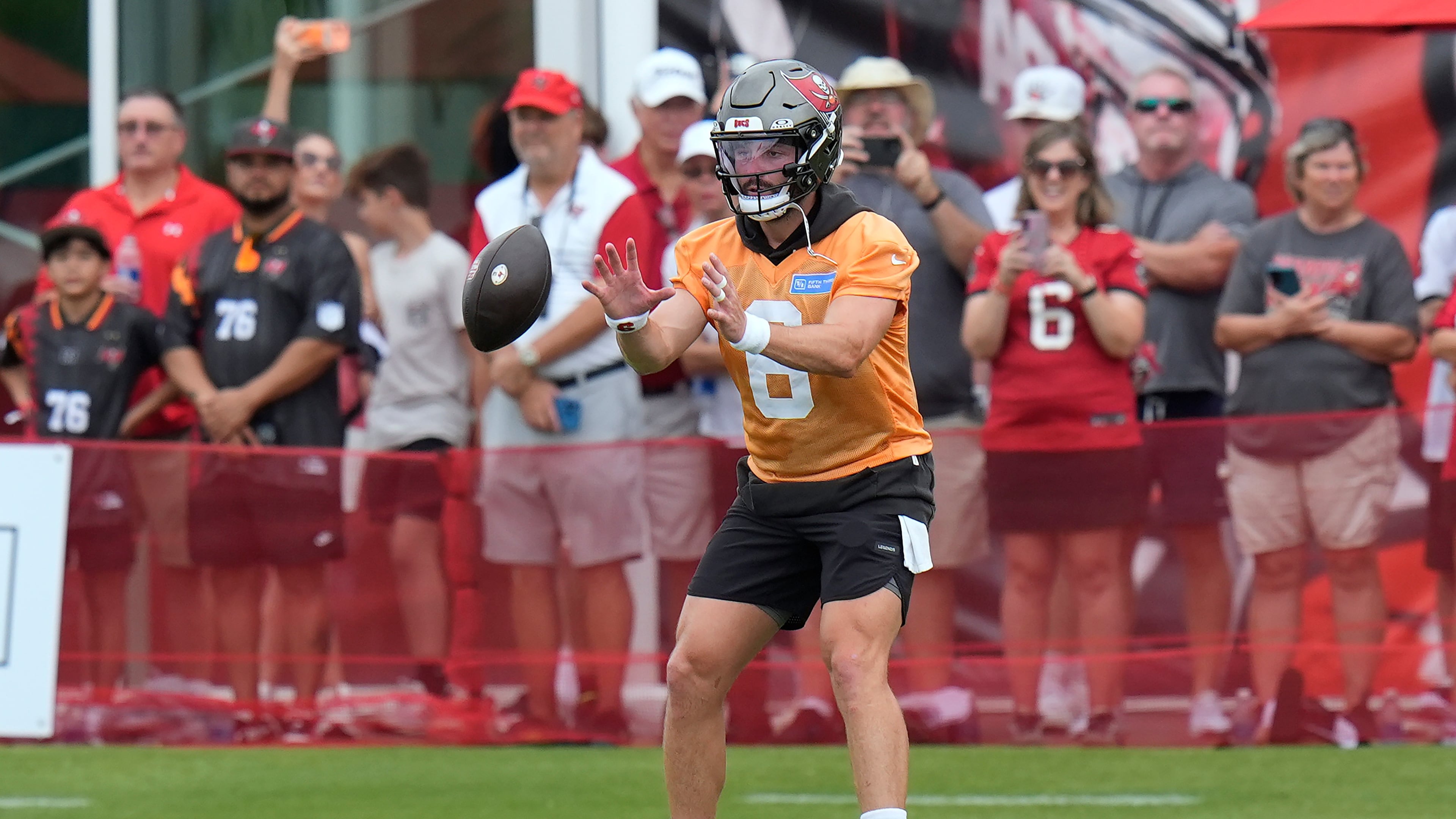 Tampa Bay Buccaneers quarterback Baker Mayfield takes a snap during an NFL football training camp practice Thursday, July 30, 2026, in Tampa, Fla. (AP Photo/Chris O'Meara)