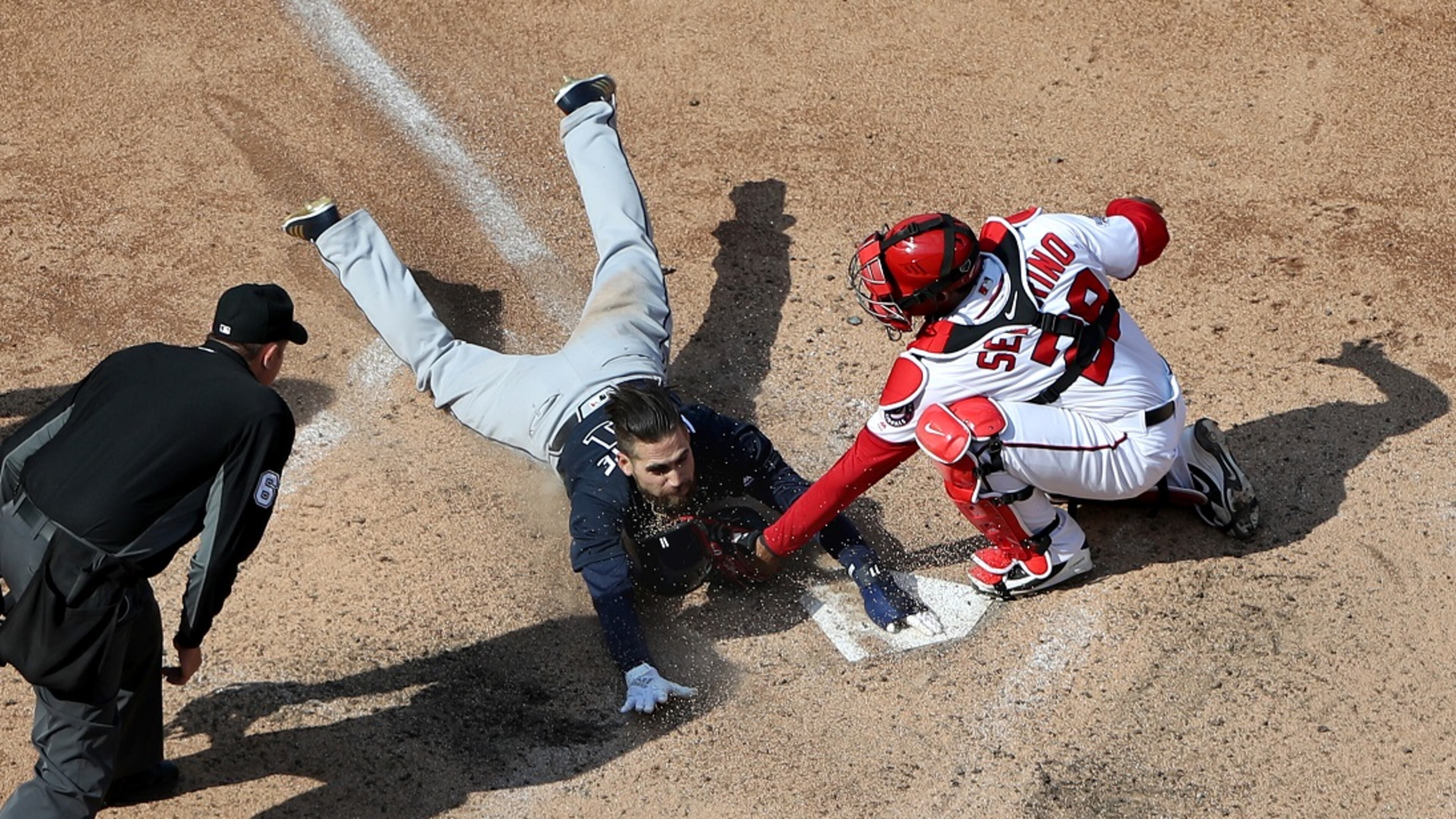 The Braves’ Ender Inciarte is tagged by Nationals catcher Pedro Severino for the third out of the 10th inning when Inciarte tried to steal home. (Photo by Rob Carr/Getty Images)