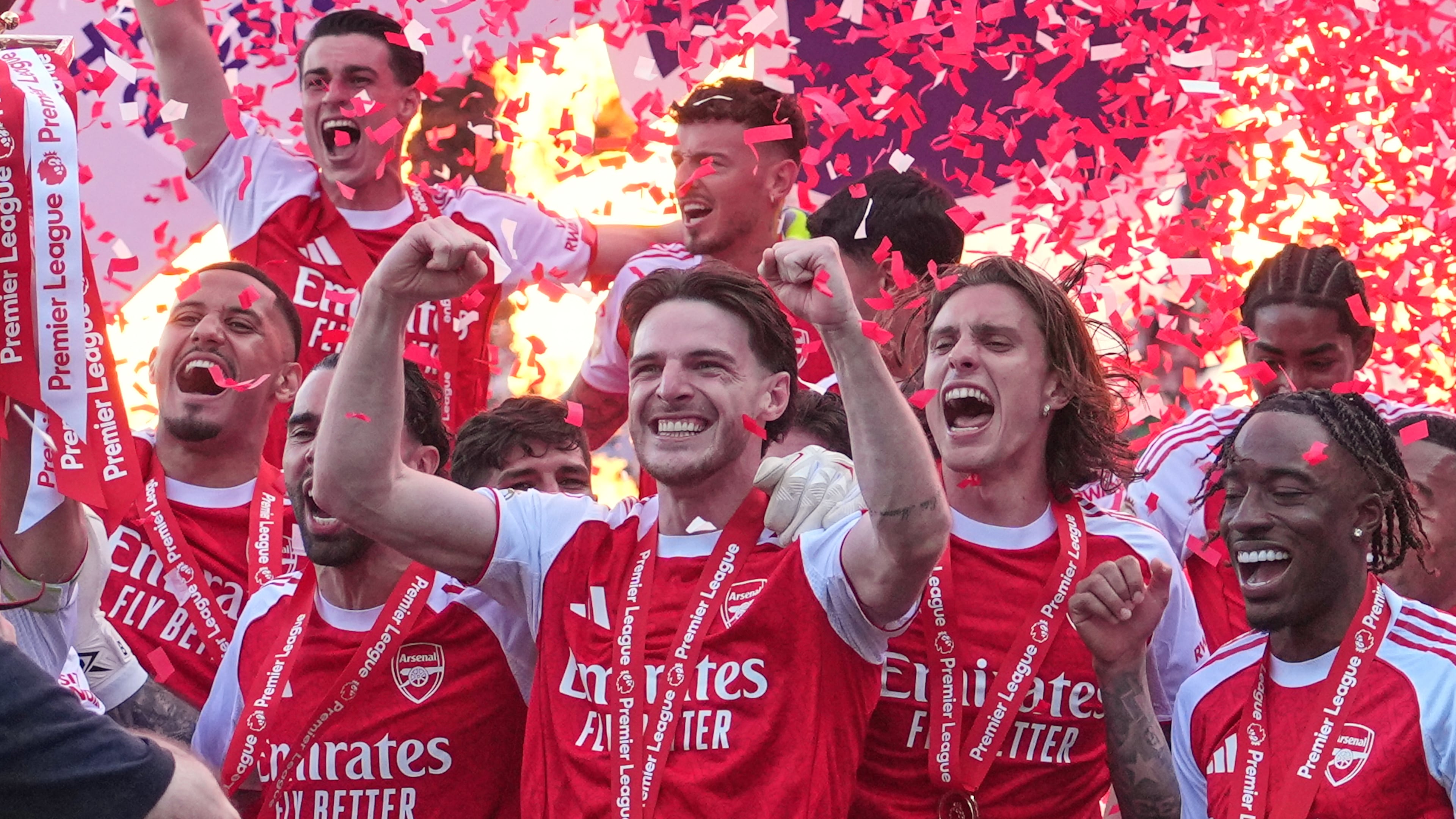 Arsenal players celebrate their Premier League title with the trophy after the English Premier League soccer match between Crystal Palace and Arsenal in London, England, Sunday, May 24, 2026. (AP Photo/Kin Cheung)