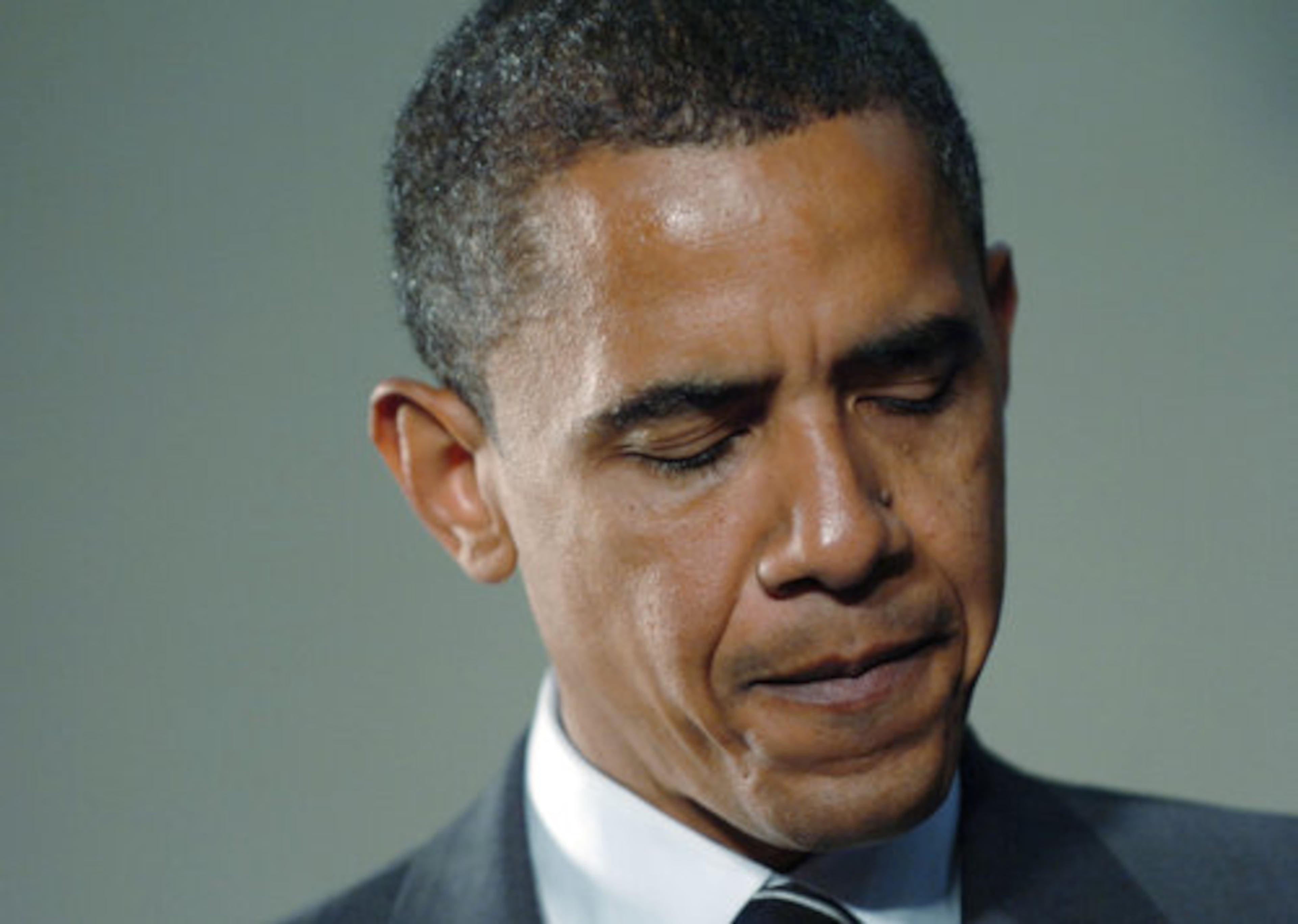 Sen. Barack Obama pauses while speaking at a town hall meeting held in the gymnasium at McEachern High School in Cobb County.