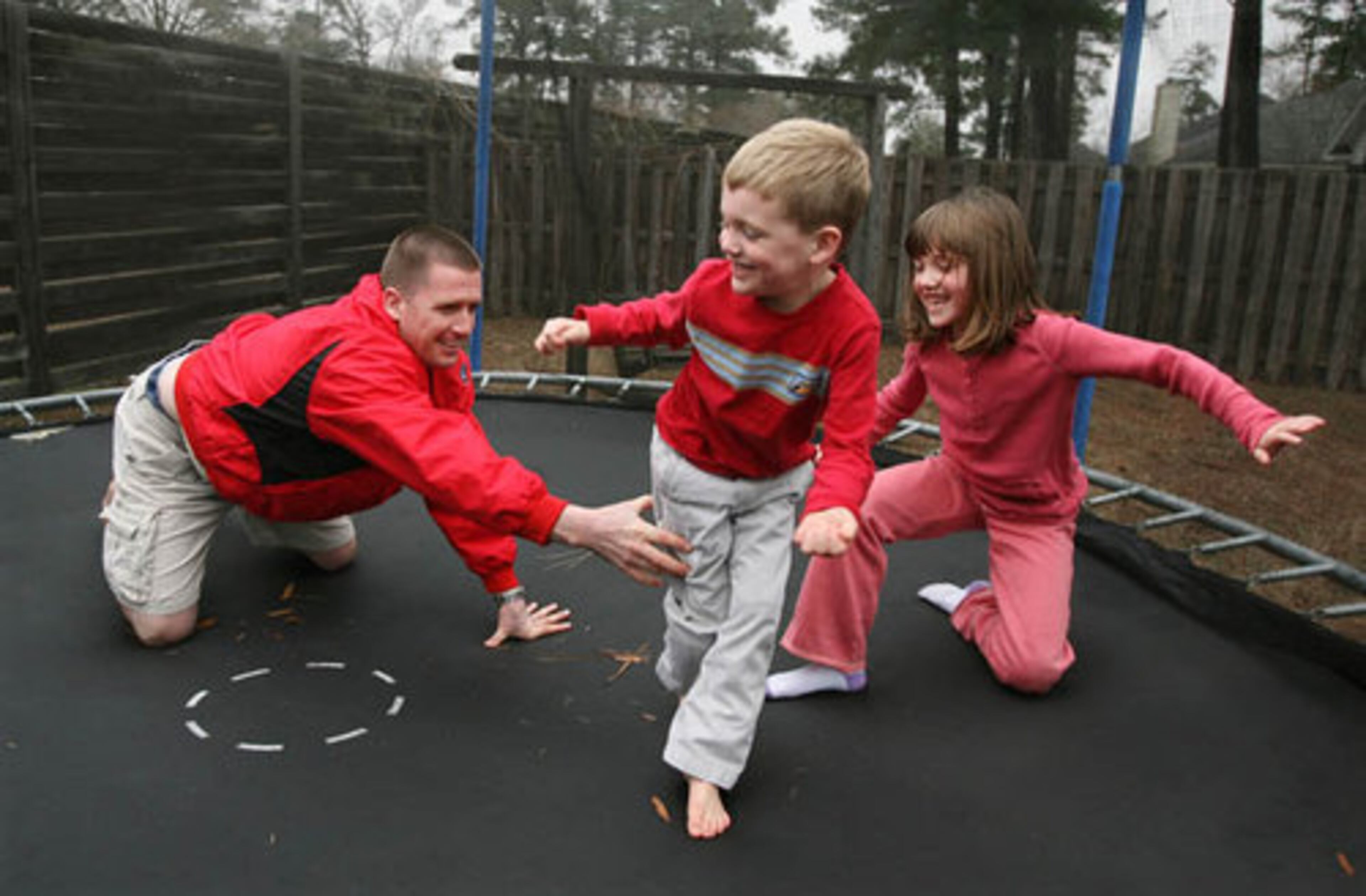 Turner is rejuvenated by joyful moments such as this -- joining Sam and daughter Elie on the trampoline in the backyard of their home in Richmond Hill, near Fort Stewart. Even when he was on leave from the war, Turner visited wounded soldiers.