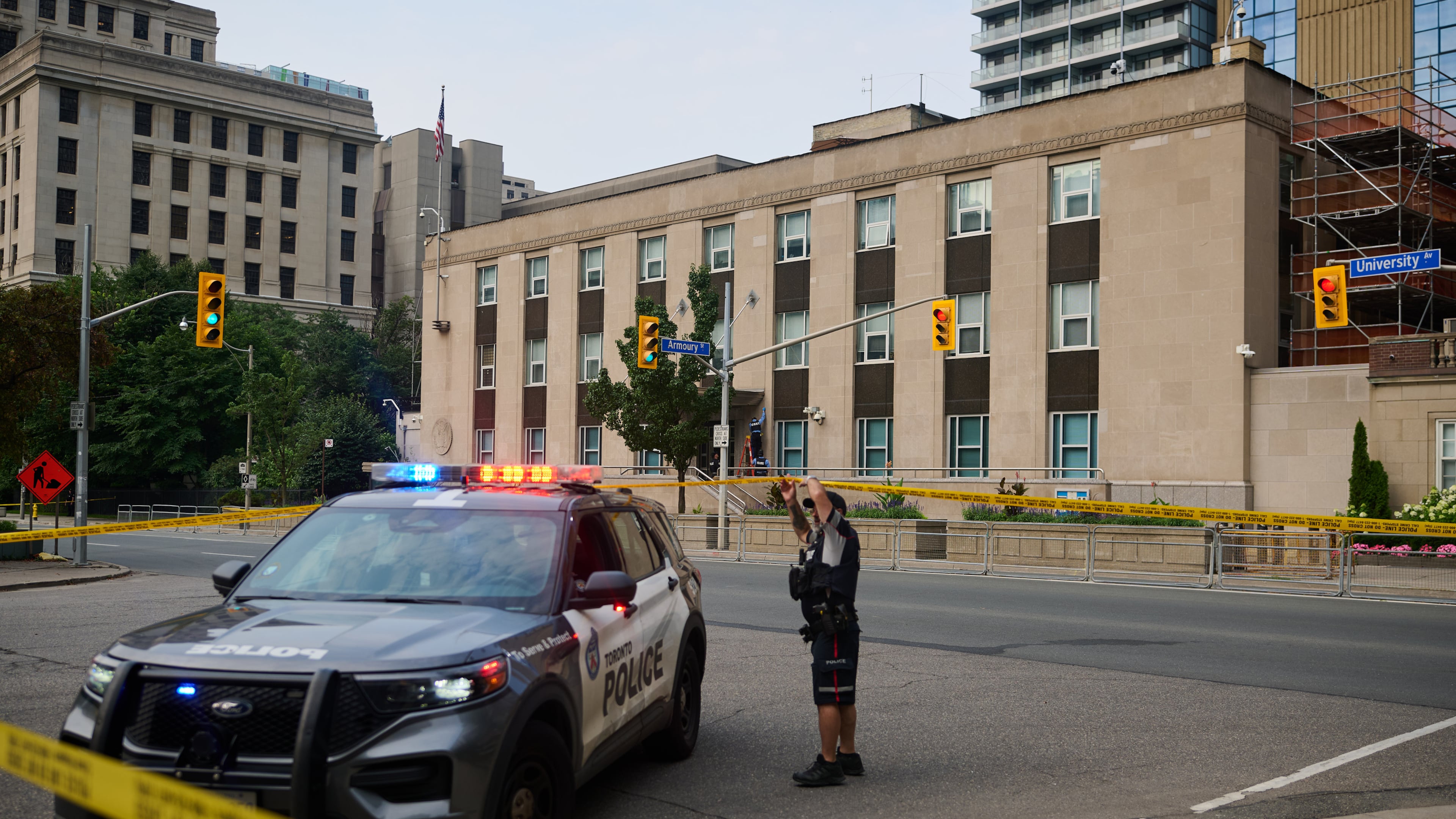 Police work the scene of an early morning shooting outside the US Consulate in Toronto, on Monday, July 27, 2026. (Sammy Kogan/The Canadian Press via AP)