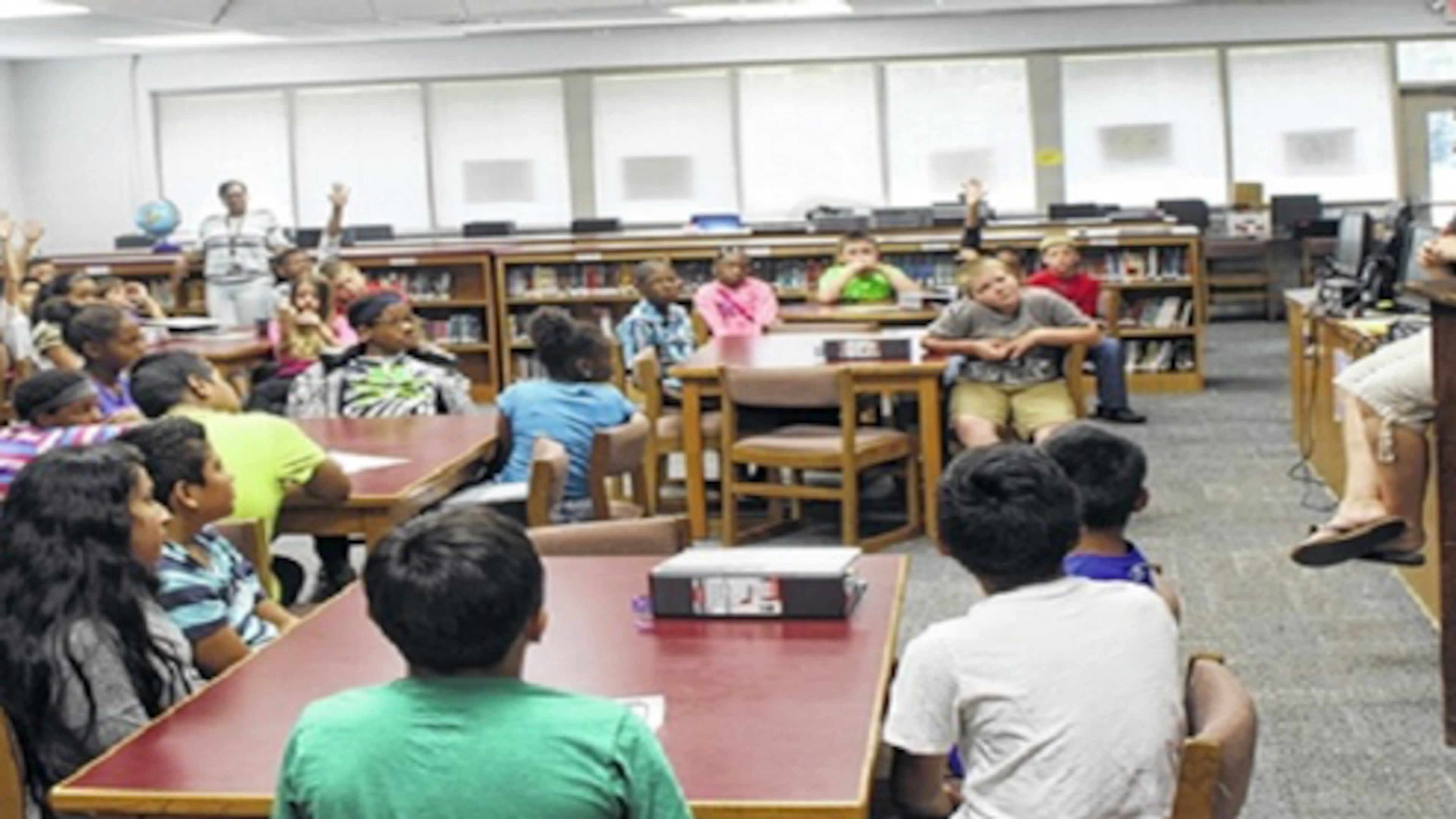 Mill Creek Middle School students get information about sixth grade. The Cherokee County School District plans to expand the Woodstock school next spring. CHEROKEE COUNTY SCHOOLS