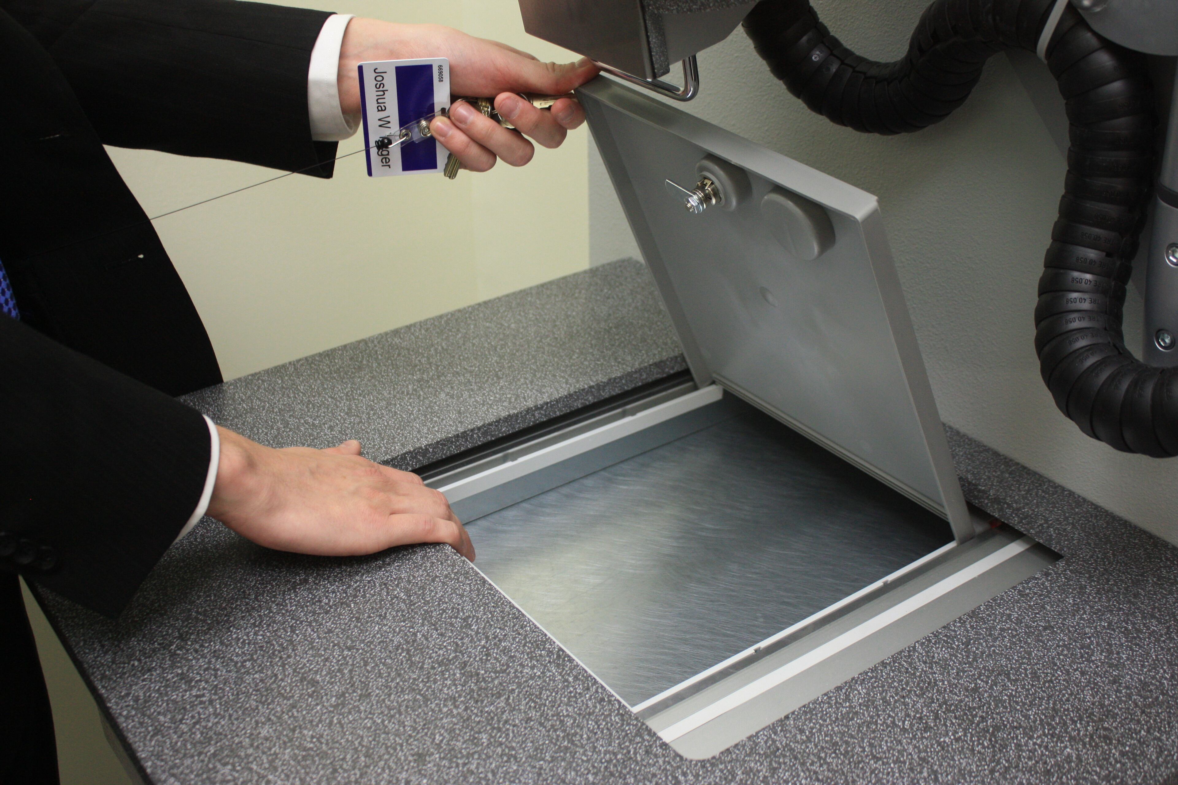 The customer can now place valuables in the box or remove them.