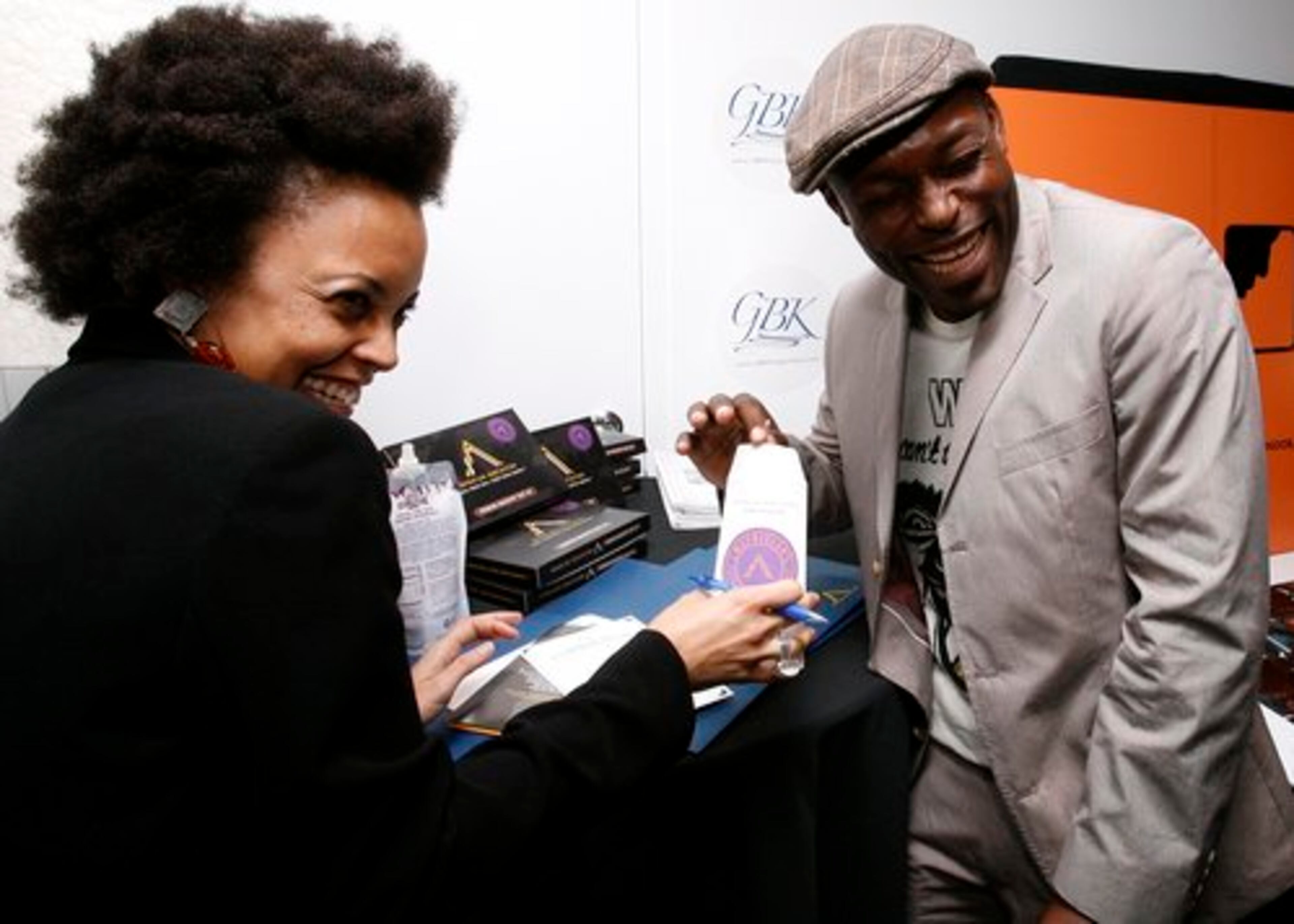 Jimmy Jean-Louis (right, "Heroes") talks DNA with Gina Paige of African Ancestry.
