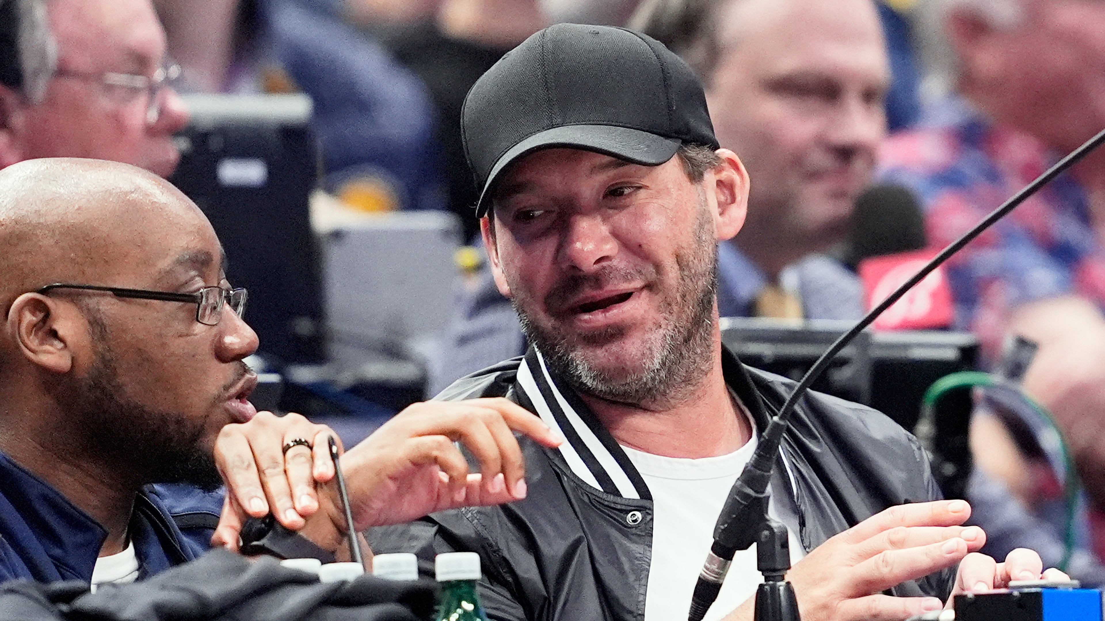 FILE - Former NFL quarterback Tony Romo, right, attends an NBA basketball game between the Indiana Pacers and the Dallas Mavericks on March 5, 2024, in Dallas. (AP Photo/Tony Gutierrez, File)