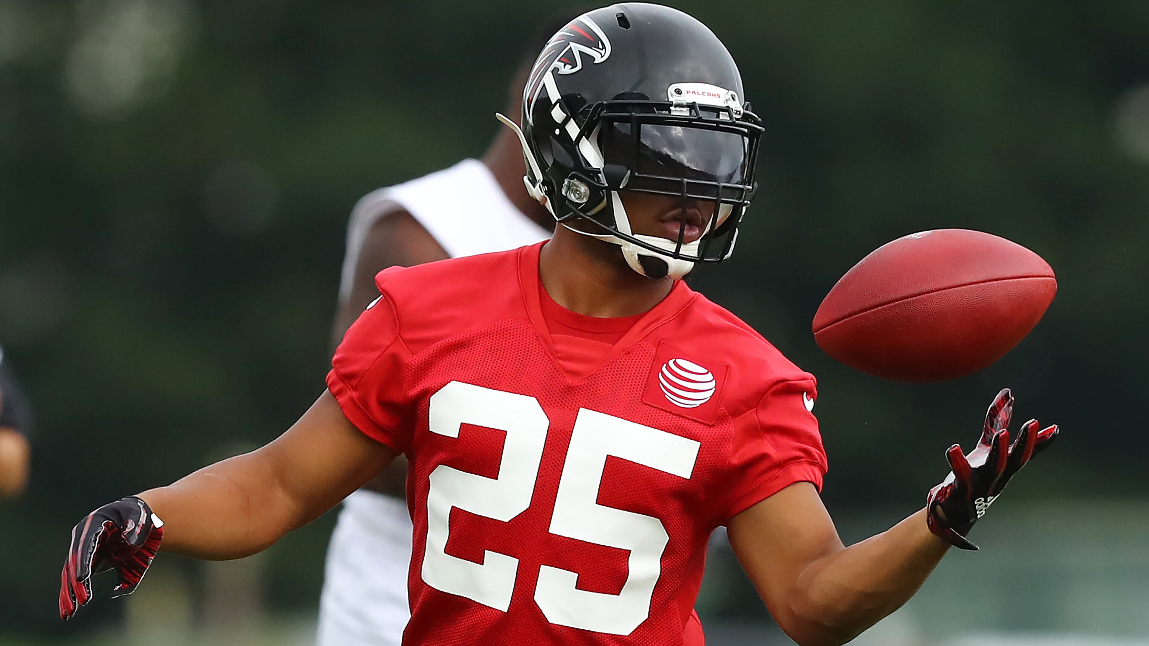 Falcons running back Ito Smith secures a pass during the second practice of training camp Tuesday, July 23, 2019, in Flowery Branch.