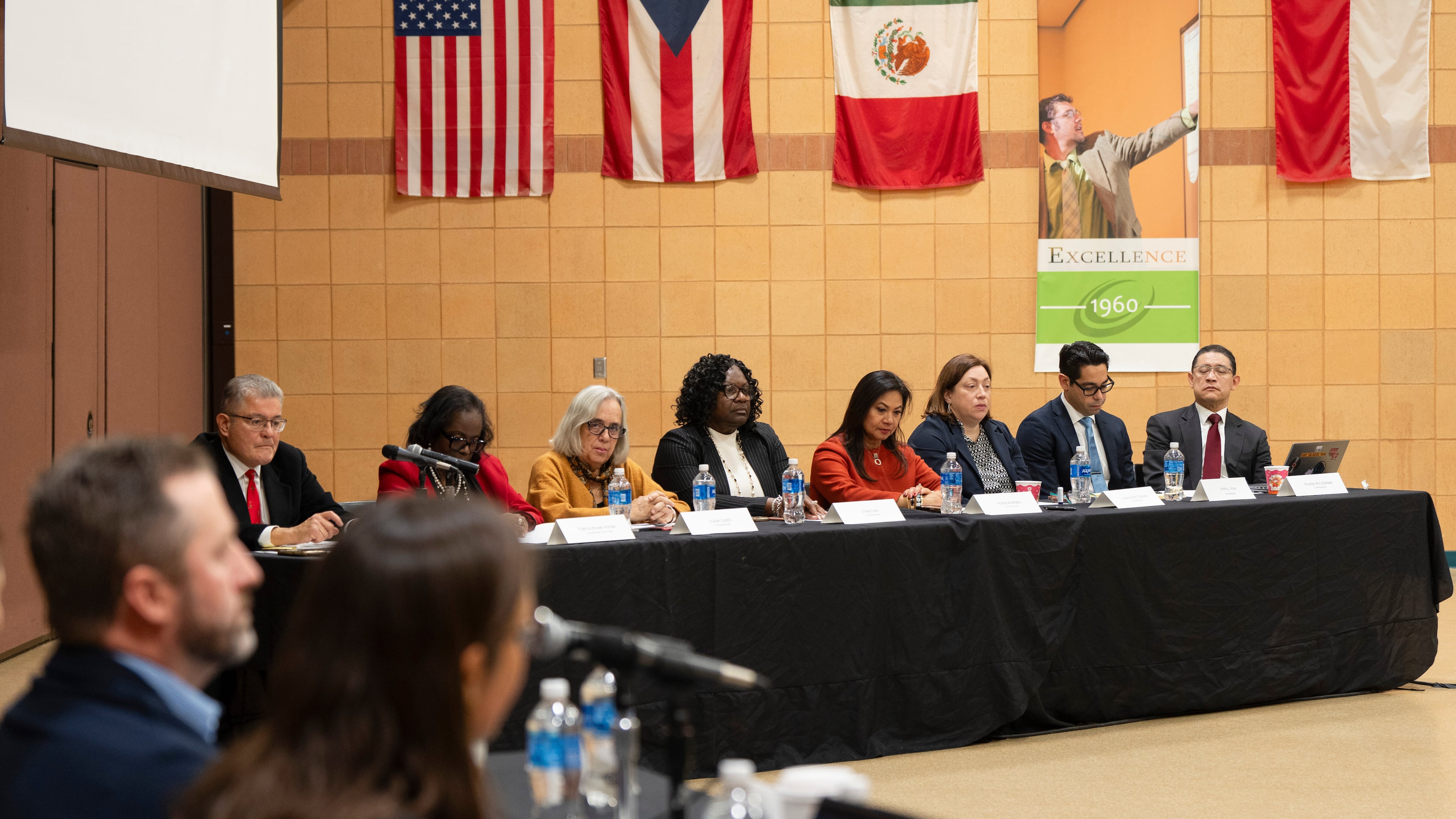 The Illinois Accountability Commission listens to a witness' account during the first hearing at Arturo Velasquez Institute at Richard J. Daley College in the Lower West Side of Chicago, Thursday, Dec. 18, 2025. (Chicago Sun-Times via AP)