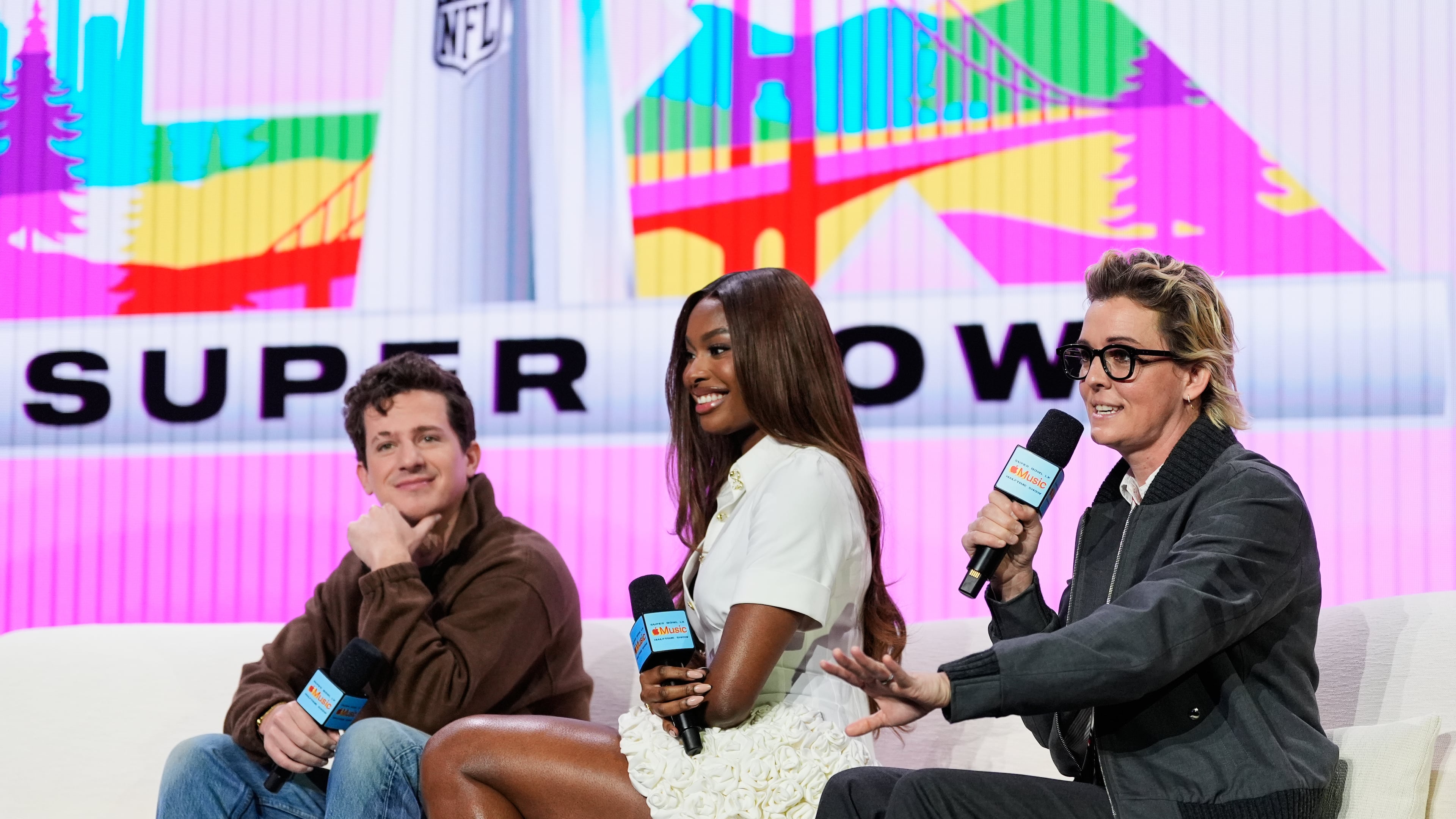 From left; Charlie Puth, Coco Jones and Brandi Carlile – who will perform the national anthem, "Lift Every Voice," and "America the Beautiful" respectively – speak during a news conference, Thursday, Feb. 5, 2026, in San Francisco ahead of the NFL Super Bowl 60 football game between the Seattle Seahawks and the New England Patriots. (AP Photo/Godofredo A. Vásquez)