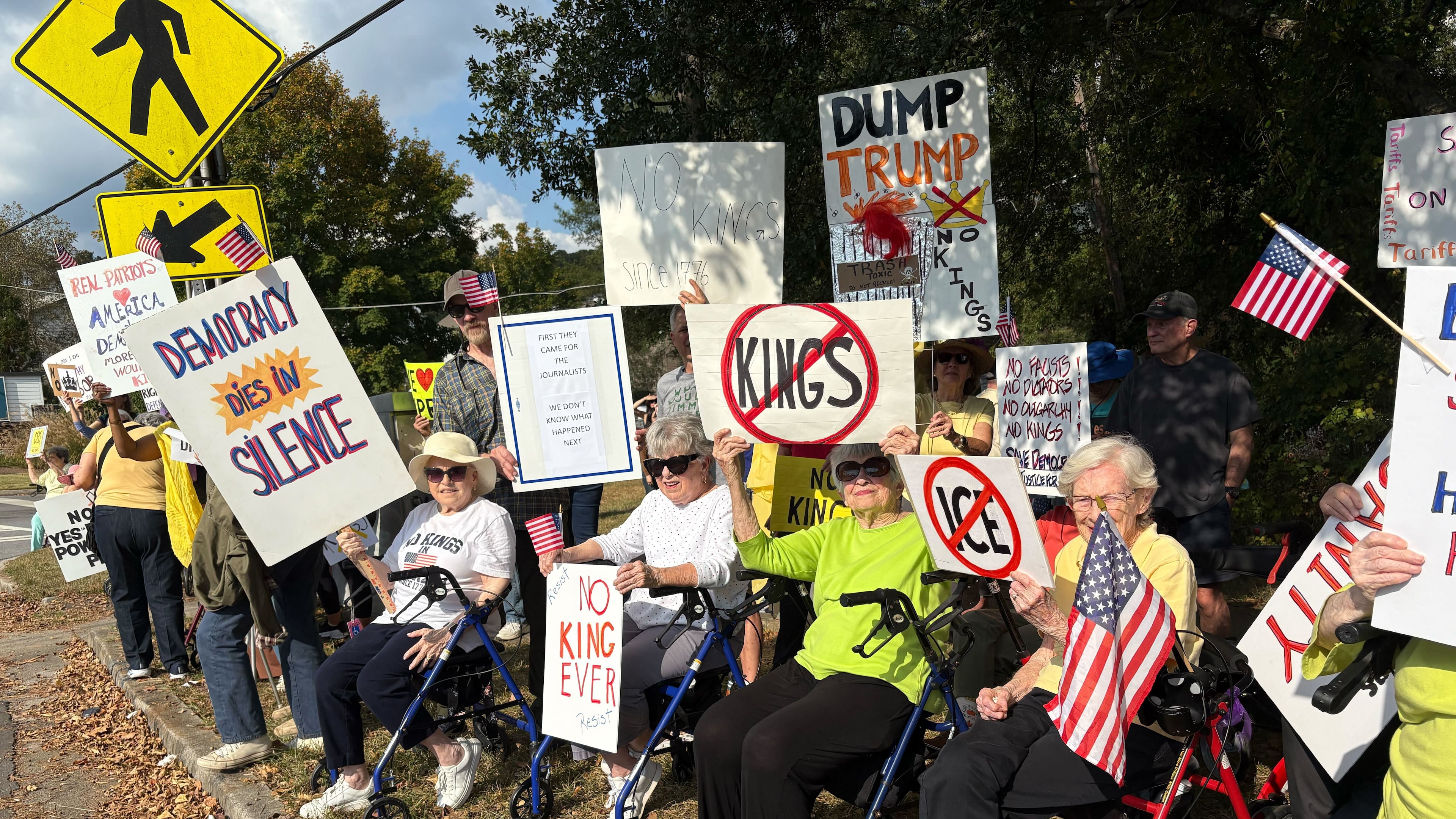 A group of DeKalb County seniors who call themselves "The Walker Brigade" lined Clairmont Road on Saturday afternoon to protest President Donald Trump and his administration's policies.
(Shaddi Abusaid/AJC)