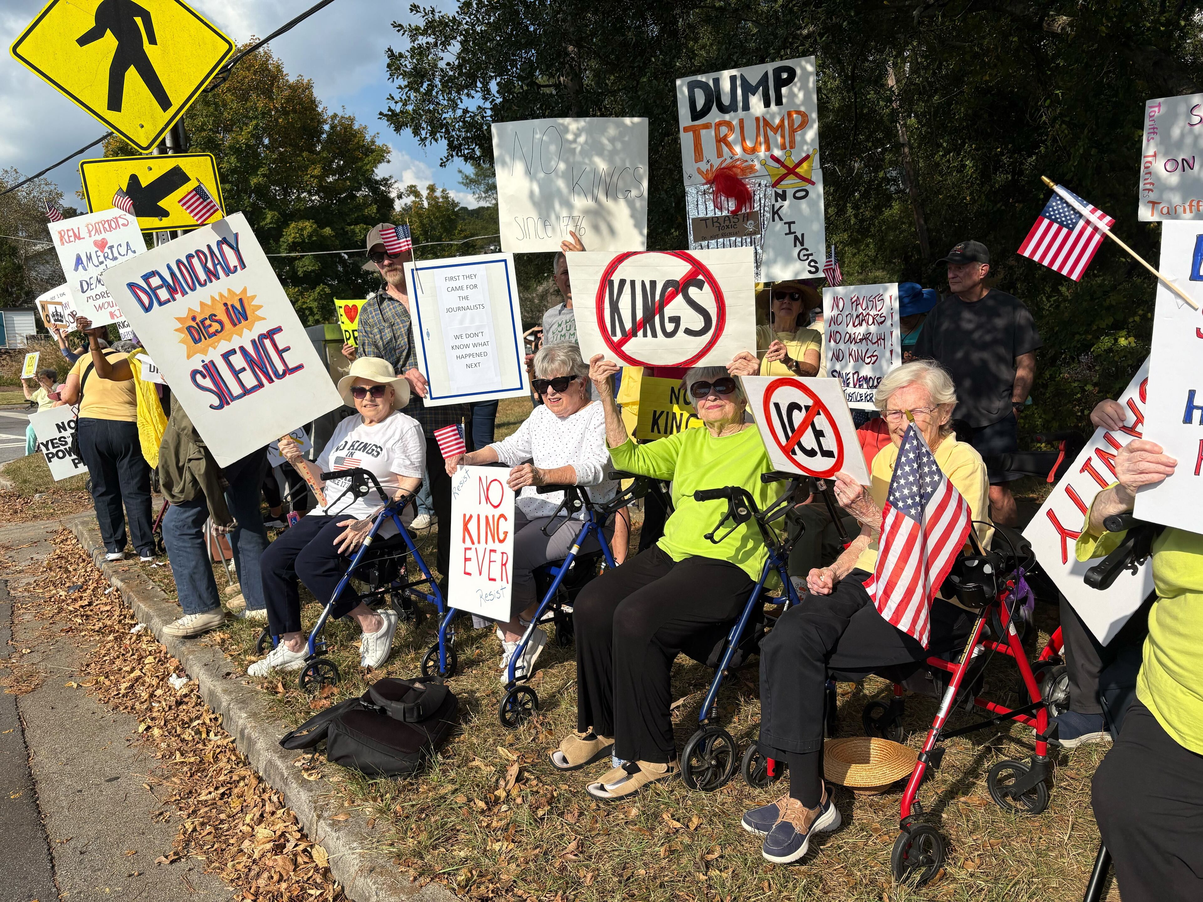To protest Trump administration policies, "The Walker Brigade" lined Clairmont Road on Saturday afternoon.